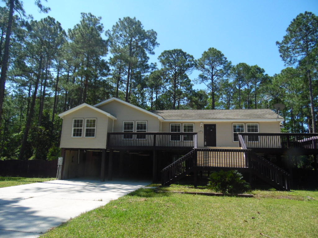 With a little love this 4 bedroom, 2 bath REO home on a large lot would be the perfect residence or rental investment! The home features, hardwood floors in the living areas, crown molding, open floor plan with split bedroom design and multiple decks for relaxing evenings. The location of the 2080 square foot home is convenient to beaches, bays, schools and job opportunities.