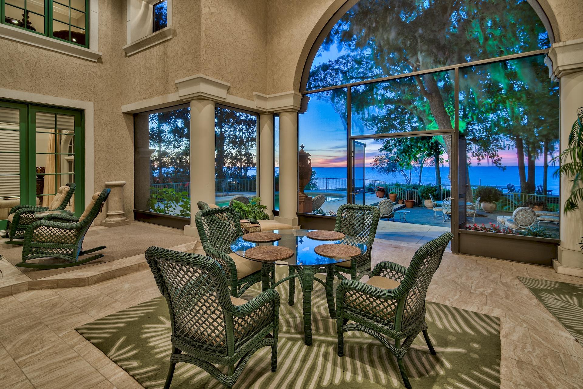 Welcome to 3212 Bay Estates Circle, located on the bay in South Walton's most exclusive gated neighborhoods: Burnt Pine in the world class Sandestin Golf and Beach Resort. Sellers are motivated. At over 6360 sq. feet and 4 large bedrooms plus huge bonus room, this custom built luxury home offers bay and sunset views that are simply stunning. Upon entering the home you will notice the soaring two-story high ceilings and windows looking out towards the oversized back porch and of course the pool and bay. To the right of the downstairs is the family room, formal dining room, and gourmet's chef's kitchen with wine-fridge and gas range. The home features two master suites, one of which encompasses the downstairs left side of the home and offers a sitting room overlooking the pool and bay, fitness room, luxuriousmaster bath, and huge walk-in closet with custom built-ins. The master bedroom also offers direct access to the enclosed porch. The second master suite (currently being used as an executive office) is located on the second floor and also offers a fabulous sitting room for watching the sunsets, as well as a fireplace, wetbar with mini-fridge, and a private bath. Also featured upstairs are two additional full guest rooms and two more baths, as well as a large bonus room that connects to a jack-and-jill bath that can easily be used as a 5th bedroom or a game-room or theater room. Privately located at the end of the cul-de-sac on Bay Estates Circle, the property has mature trees and landscaping which add to the private and luxurious feel of the home. The backyard is very private and offers a pool and large wood patio for enjoying the bay views and incredible sunsets. The Burnt Pine Golf Club has been deemed the "Crown Jewel of Florida Golf" by Golf Magazine, twice recognized as one of the "Top 30 Courses in Florida" by Golf Digest, and named three times to Golfweek's list of "America's Best Resort Courses". The Sandestin Resort has beach access by golf cart (road goes under Hwy 98), four professional golf courses, a marina that can hold large yachts, a world class tennis center, bike rentals, work-out facility, and tram that travels the entire resort. The Village of Baytowne Wharf is very close to Burnt Pine and offers a variety of entertainment and shopping. Furnishings are negotiable. Buyer is to please verify all information contained herein, including lot dimensions, square footage, room dimensions, and all other information.