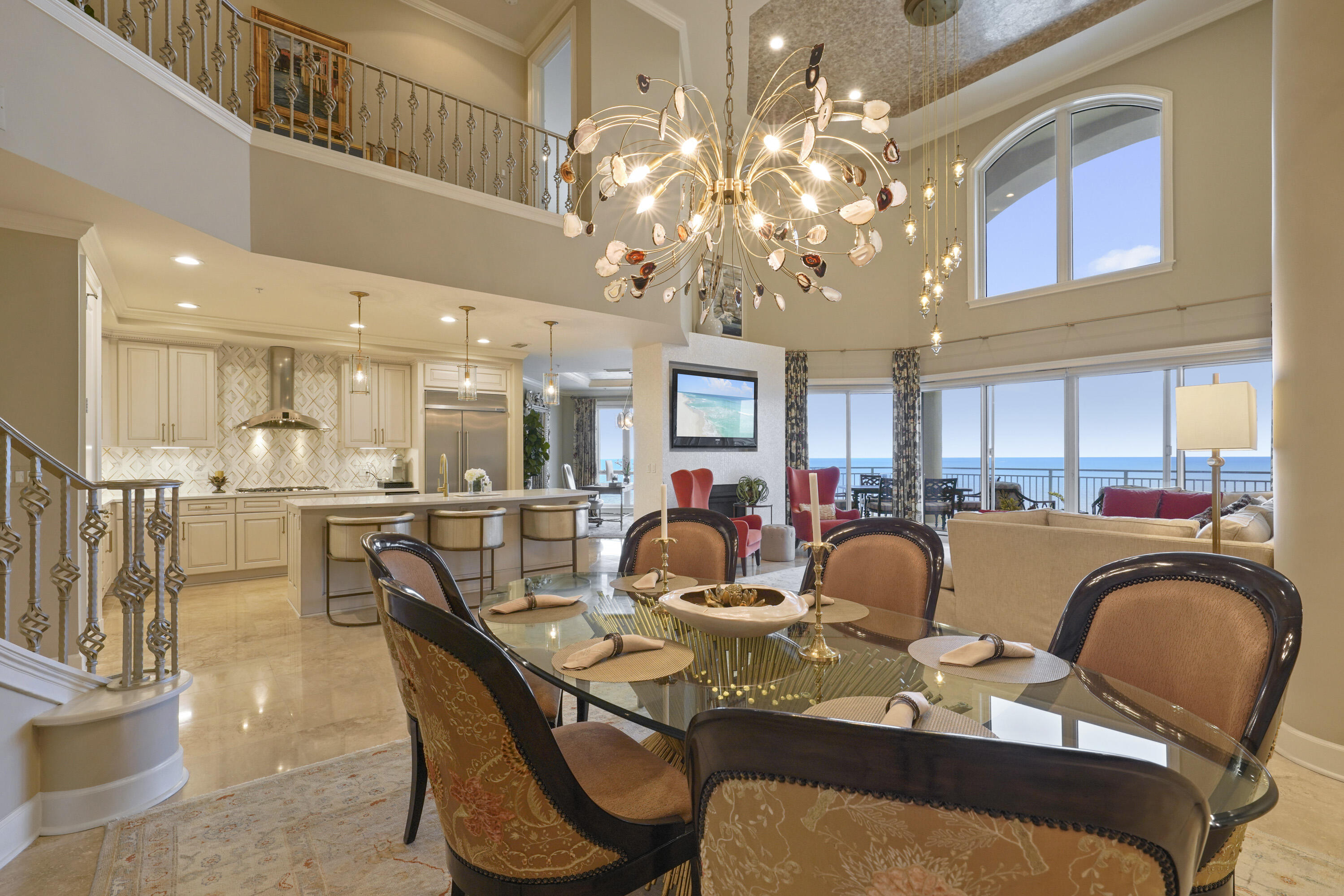 This stunning penthouse in Grand Dunes' South Tower is a rare gem, being one of only five true penthouses within the Grand Dunes. This exquisite 5-bedroom, 5.5-bathroom Villa offers 4,500 square feet of luxurious living space and is fully turnkey, ready to welcome you with all furnishings included, aside from a few personal items. Designed with the expertise of one of the area's premier design firms, every detail of this Villa exudes elegance and meticulous craftsmanship. As you step off the semi-private elevator into your private foyer, the beauty and attention to detail of this exceptional Villa will immediately captivate you. Key features of this penthouse include two primary suites, one on each level, along with top-of-the-line stainless steel appliances, a 5-burner natural gas cooktop, Calacatta Dorada Quartz countertops, and a built-in natural gas grill on the spacious 11-foot wide covered balcony. The kitchen, hallways, foyer, and bathrooms are adorned with elegant travertine flooring. The primary bathrooms each feature two-person jetted tubs and dual shower heads. The Villa also boasts an in-home movie theater, complete with seven reclining leather chairs, cup holders, and a large flat-screen TV with surround sound. The media room also features custom cabinetry with granite countertops, a wine cooler, and a mini refrigerator.  The living area features 19.5-foot ceilings, and four of the five bedrooms offer Gulf views.

Located in one of Miramar Beach's most coveted communities, this luxury condo offers world-class amenities including a fitness center, a heated swimming pool, and a hot tub. The complex provides direct beach access, allowing you to easily enjoy the pristine white sand beaches and Emerald Green Waters of the Gulf.

Grand Dunes provides an array of exceptional amenities, including 24-hour security, gated entry, and beautifully maintained landscaping. Owners enjoy the convenience of two levels of gated underground parking and semi-private elevators that open directly into the private foyer of their Villa. The community features private heated pools and hot tubs, an Owner's Lounge complete with a fitness room, and overflow suites available for owners and their guests. Additionally, residents have access to 200 feet of deeded beach, a Lagoon-style Gulf-front pool, and beach service.

Grand Dunes is recognized as the Emerald Coast's most desirable rental-restricted beachfront development. 

Contact us today to arrange your private viewing of this stunning Villa!