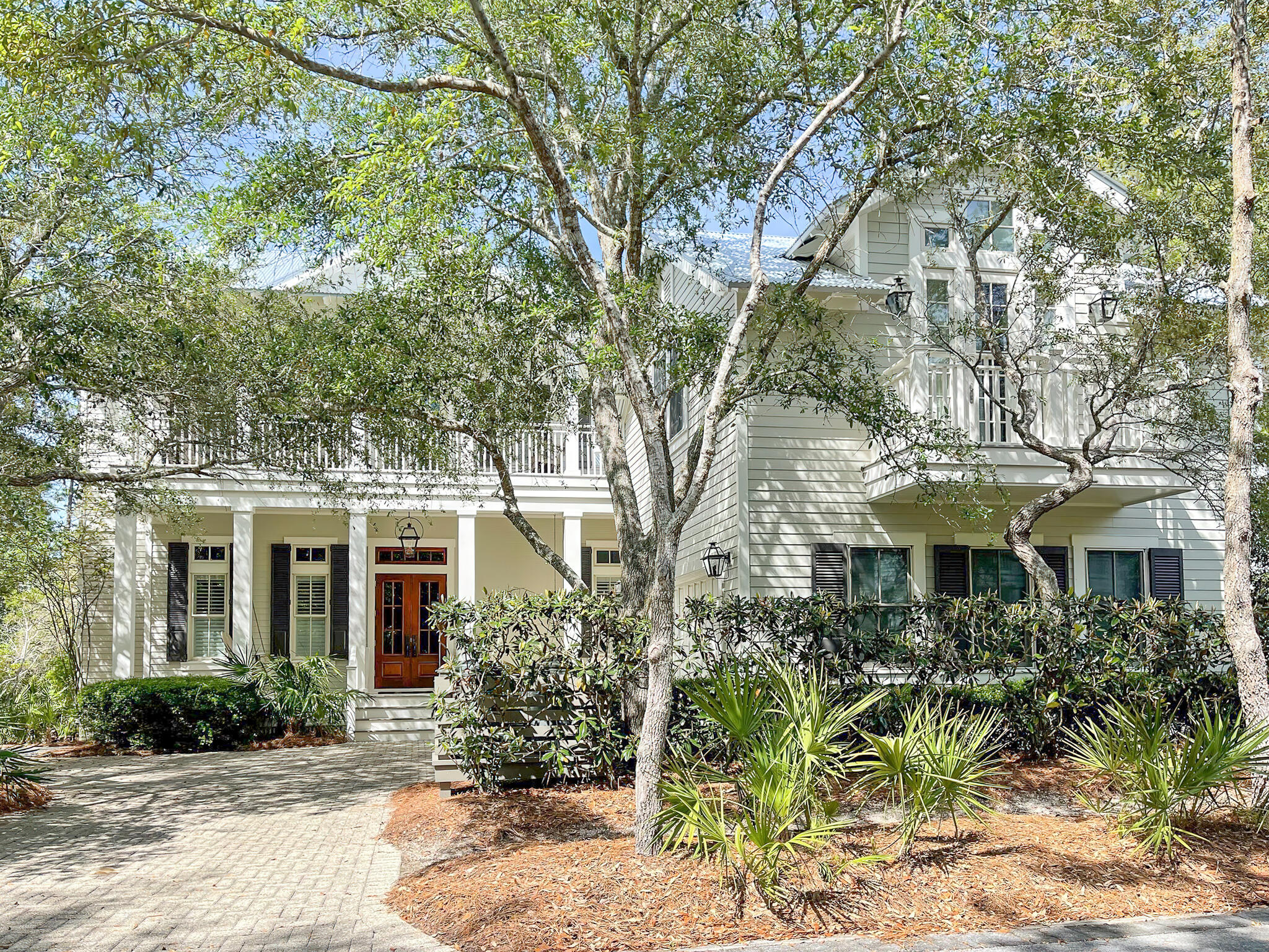 This tranquil legacy home in Watercolor has 92 waterfront feet adjacent to Western Lake. Sitting out on the spacious verandas one experiences the sights and sounds of nature. The backyard privacy overlooking Western Lake cannot be overstated. The best location in Watercolor, this phase one home has never been rented and has had only one other owner since new in 2001. Updated in 2011 by Martin Properties of NW FL this renovation was a collaboration between architect, Dawn Thurber, and interior designer, Georgia Carlee. The ''soul'' of this property is evident as you walk through the nearly 4,000 sq ft, 4 bedroom 4 1/2  bathroom main house and 1 bedroom, 1 bathroom, carriage house over the 2 car garage.  .  Entering the main house one has views looking toward Western Lake ... through the redesigned media room complete with Quartz countertops and wet bar area. There are three bedrooms on the first floor and an office that could be converted to a bunk room with a full bath across the hall. Two of the bedrooms have access to the 1st floor screened in porch which has a swing bed for those lazy afternoons. Upstairs is a large gathering room with a huge Coquina Shell stucco fireplace. Mounted on the fireplace is a large two-way mirror concealing a TV. The kitchen has been thoughtfully redesigned with new granite counters and cabinets.  There is a breakfast nook adjoining it as well as a large dining room for entertaining guests.  The Master bedroom has a commanding view over the green space below as well as access to the second-floor veranda.  This veranda is where the magic of this home is...quiet, serene and private.
Watercolor is known for its amenities and you are within easy walking distance to all of them, especially the Watercolor Beach Club, Fish Out Of Water, The Boathouse, Cerulean Park, Amphitheatre and Town Center. Experience the trails, bridges, walkways and parks or hop on your standup paddle board for some of the best coastal dune lake views in all of South Walton.  It's all part of the Watercolor lifestyle. All dimensions are estimates and buyers should verify that which they deem important. Sold fully furnished.