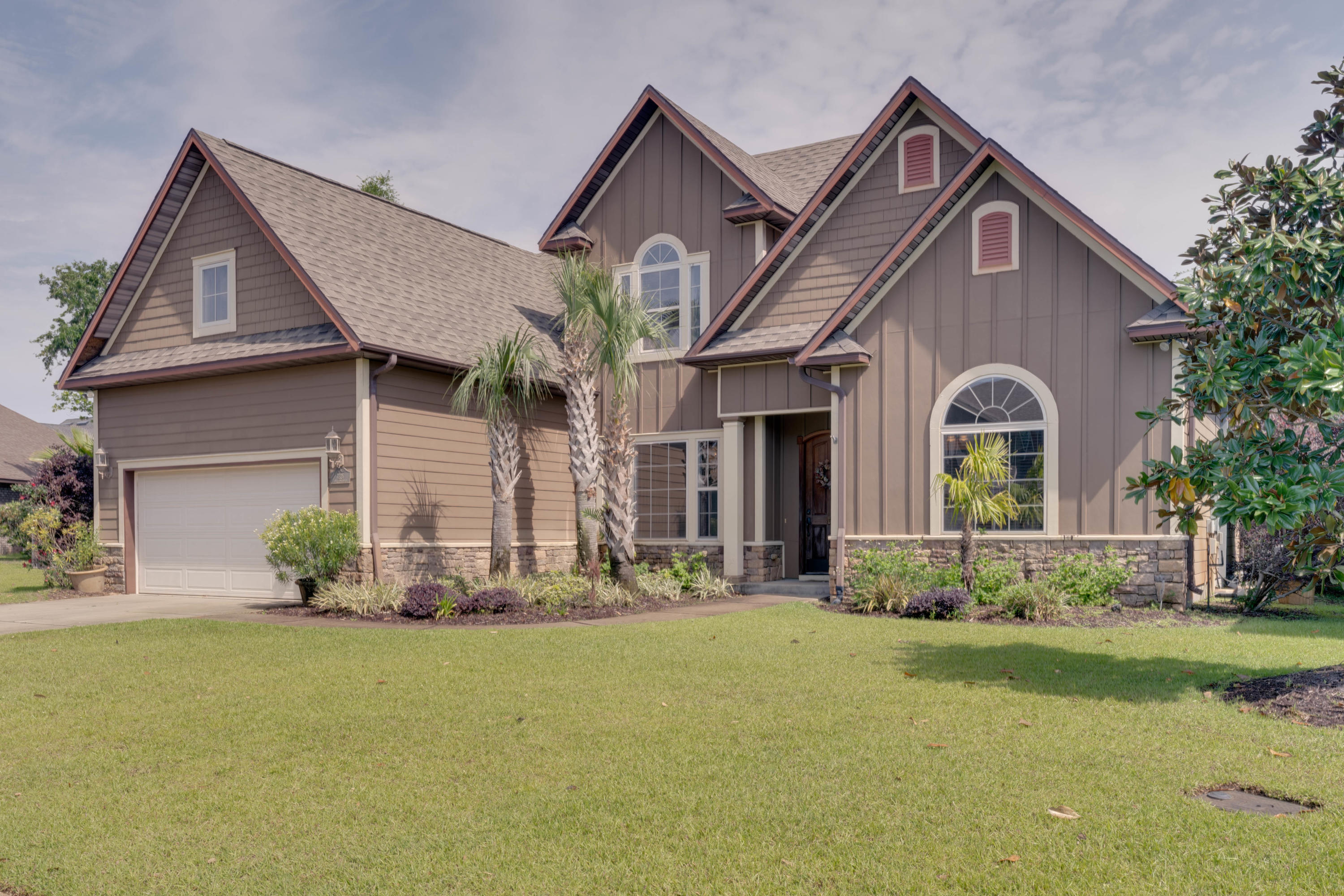 Spectacular CUSTOM POOL HOME by Fountain Design Build! Stunning exterior & interior architectural character in the coastal community of Magnolia Village in Navarre.New Roof  coming May 10th over $24k. The backyard is luxurious & functional w/ an in-ground saltwater gunite  pool. Pool pump, motor and saltwater filters new in 2019.  Large sun deck platform & a seat ledge, beautiful stone fireplace, paver patio, custom pergola with fans, dining or yoga platform, additional stone work incorporated into the lush landscaping, stained privacy fence, sprinkler system w/new heads, & seamless gutters. The interior has been meticulously maintained & features Brazilian wood flooring & European stone w/ designer accents in all baths. New carpet & pad throughout Stain Master River Dance. Delight in the gourmet kitchen w/ GE profile stainless appliances, built-in refrigerator with new ice maker and dispencer, upgraded elite glass hood vent, breakfast bar, hand selected granite countertops & the finest in custom cabinetry. Beautiful Mosaic backsplash too! The large living room boasts a custom milled mantle surrounding a marble trimmed electric fireplace with simulated logs & 2 sets of french doors leading to the back patio. Spacious master suite located on first floor with sitting area off covered lanai. The master bath offers a spacious Whirlpool tub featuring European tile w/ designer accents, a large separate shower w/ seamless glass, Kohler's fixtures, & hand selected his and hers granite countertops. The 4th Bedroom can also serve as large media center (15' x 25') w/ a wet bar and beverage center for entertaining. Additional features include 8' doors, 5" baseboards, 2 HVAC systems, & shelving for optimal storage in the garage. Garage door has new springs and works perfectly. The home is bonded for termites. Monitored alarm system in the home for peace of mind. Ask about furniture that can be purchased separately. Perfect low traffic cul-de-sac location. This home has an extra half lot for expansive private pool area! No detail was left out of this one of a kind home. Catch the sunsets on the Sound via public water access located at the end of Joybrook Rd. just a short 5 minute walk away. Schedule your private showing today before it's gone!