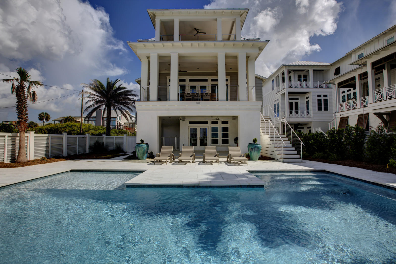 Stunning & elegant, 300 Pompano is truly a builder masterpiece. Pompano comes complete with every finish the coastal luxury buyer is searching for. From the standing seam roof lines to the open living spaces, 300 Pompano has it all. The exterior is appointed with lush landscaping and a heated pool with a cascading waterfall. The exterior also has a complete high end outdoor kitchen, pavers and a two car garage. One notices right away, not only will this exquisite home be a fabulous rental home but a full time owner would gladly reside here due to the size of the lot and location. The pool deck is surrounded by firerock which leads into the 1st floor. On this floor you will enter into a large Cabana Room where you will find classic shiplap walls throughout. This floor comes complete with 2 bedrooms, 2.5 baths and elevator.  All the bathrooms are finished out with quartz tops and high-end Waterworks fixtures. The mahogany side door is truly a piece of art located next to the elevator leading to the main levels. Throughout this masterpiece you will see sanded walnut hardwood floors. The huge gourmet kitchen is all high end with Thermador appliances.  A perfect gathering spot after a long day at the beach.  A few kitchen features: the stove is gas with a griddle; there are 2 dishwashers and 2 ice makers and a wet bar. The best part about the open 2nd floor are the panoramic, forever gulf views. You are close enough to feel like you are at the beach without the high risk associated with being right on the water.  The gas fireplace is another piece of art finished off with Coquina shell.  Home is wrapped with Kumara decking and state of art metal rails.  The 3rd floor has breathtaking gulf views, especially from the master suite. There is also an additional bedroom and a full bath . Other great features include a whole house Sonos wireless home sound system & a Manabloc water distribution system.  300 Pompano is located near Historic Rosemary Beach and steps to the beach.  This luxury home offers up location, space, privacy, huge rental potential (see docs for details), attention to detail, parking & the best part is the perfect fit for a permanent residency for the 2nd home owner tired of being crammed into a small cookie cutter type neighborhood.  This home is being sold completely furnished. Buy now, rent and retire.