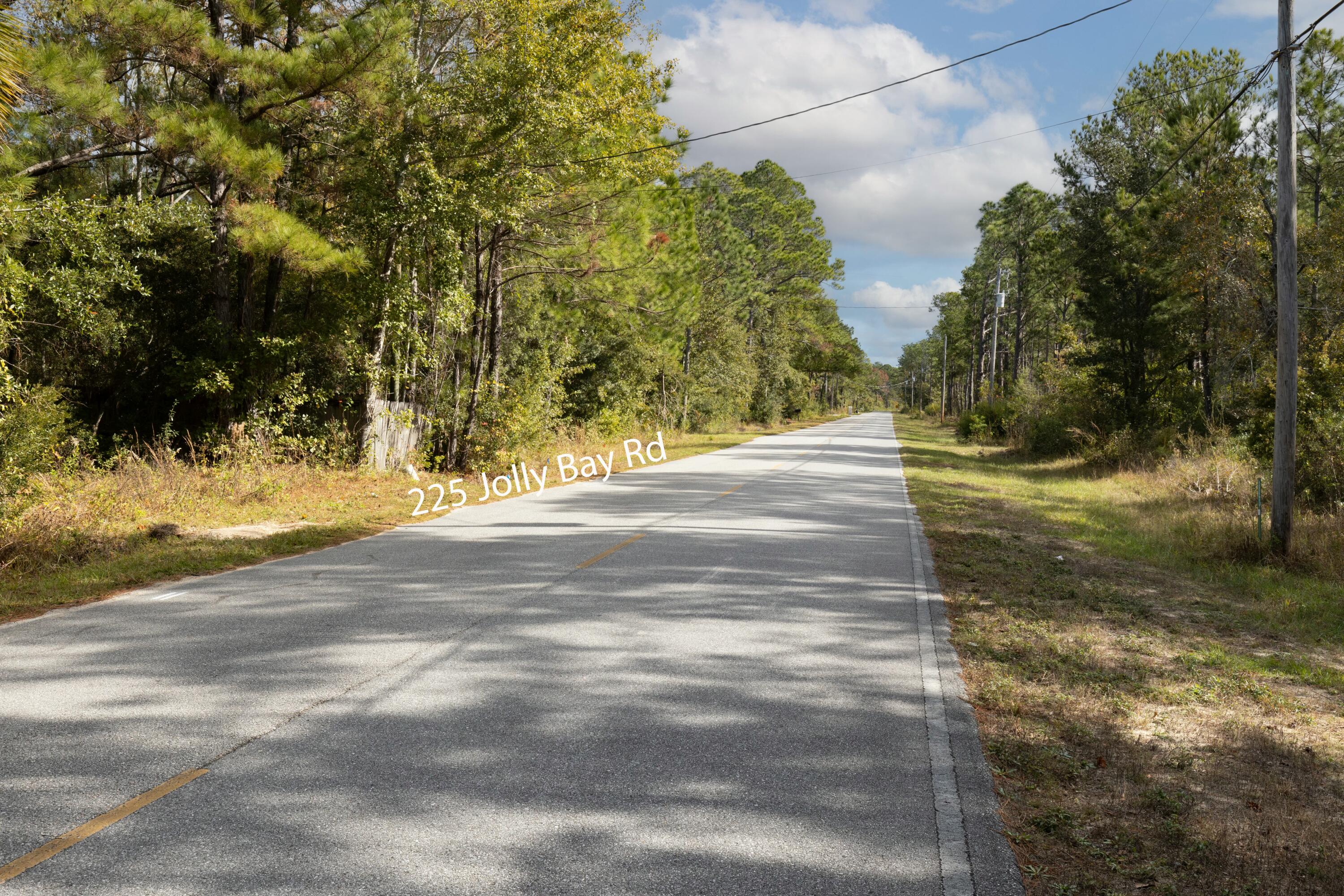 NO HOA or RESTRICTIONS!!! This beautifully wooded lot of approx .459 acres is located across the street from Choctawhatchee Bay on paved road (Jolly Bay Road).  Opportunity awaits you to claim this prime parcel of land.

The parcel previously had a 3 bed/2ba (1,380 sqft) dwelling that was demolished in September of 2020.  City water is available, tap is paid.  Sewer is also available, tap fee is due.  There may also be an old well and/or septic on the property. It will be buyer responsibility to complete due diligence to confirm existence and usability of any of the existing utilities.

Zoned Rural Village, allows for auxiliary dwellings. NO FLOOD insurance required and No Wetlands per GIS mapping.  

Easy access to Hwy 331 bridge with NO TOLLS. Conveniently located approx. 5 miles from Hwy 98 with easy access between Destin and Panama City Beach.    

Spend your weekends enjoying the endless array of outdoor activities and water sports, some including (fresh or salt water) fishing and convenient parks for hiking and exploring. Plenty of space for all your fun recreational toys! Multiple public boat ramps nearby!

Only 10 minutes to Publix grocery store and approximately 15-20 minutes from some of the most beautiful white sandy beaches on Florida's Emerald Gulf Coast. Take advantage of the close proximity to fabulous shopping and restaurants on 30A, and the World-famous Crab Island.

All Information and dimensions to be verified by the buyer. The buyer is responsible to verify with county and/or local resources to ensure they can do what they want to with the property.  Buyer responsible to verify existence of all utilities, if any.