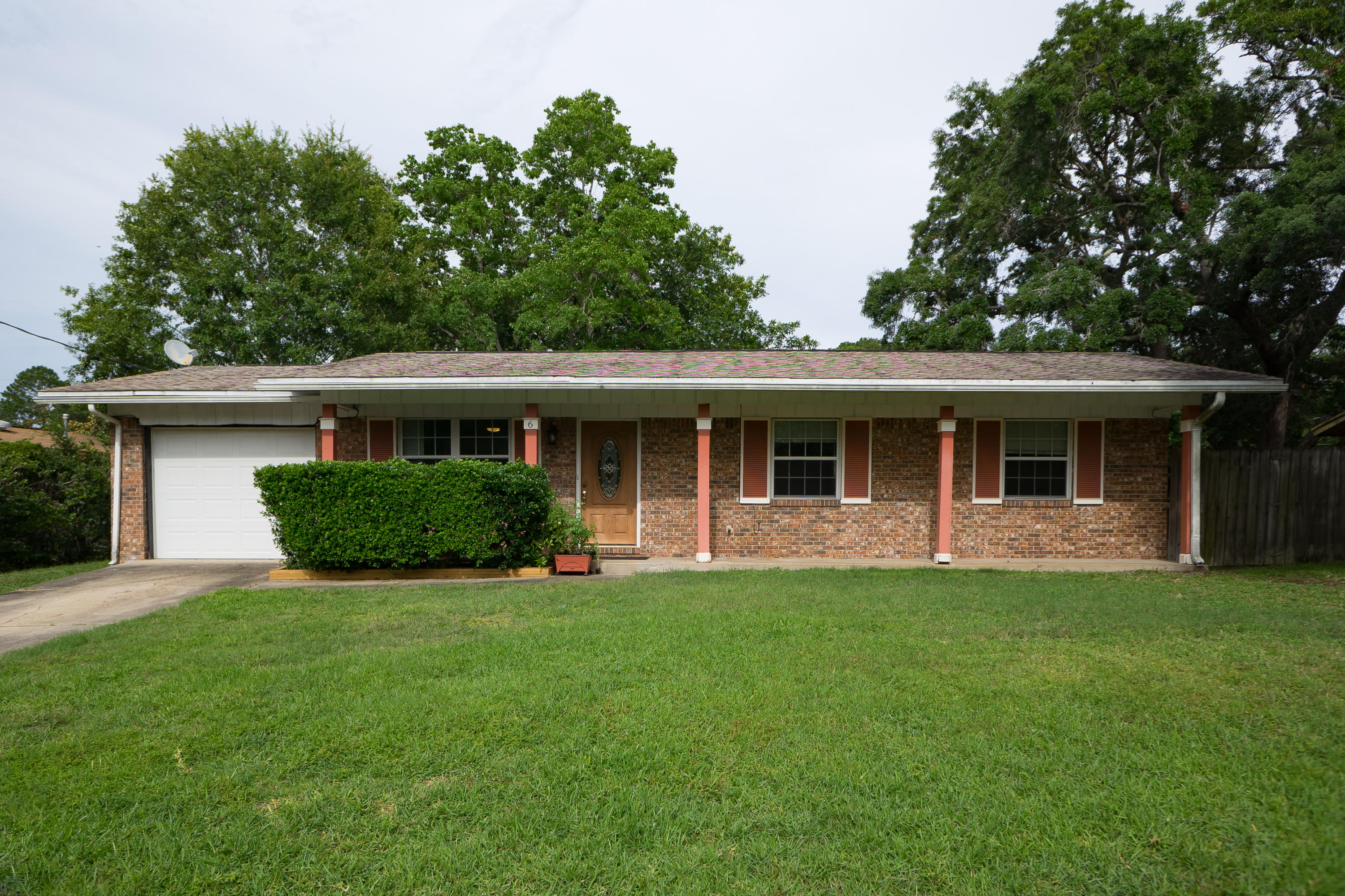 Lovely ALL brick home on a cul-de-sac is set high up on a lush yard. Excellently maintained; newly painted in cool, neutral shades. Wooden front door with beveled glass center sets the tone for quaint yet upscale. Living room leads to a dining area; track lighting and panel ceiling create ambiance. Prepare incredible meals using butcher block counter tops and the latest stainless steel features. GE freezer in the garage. Bonus room has over sized sliding glass doors overlooking the back patio; curtains match the crown molding. Large enough for a gym or your next event. Bedrooms have 12'' tile floors. Master bathroom has a marble shower with seat. The gardener in you will enjoy the outdoor compost bin, sprinkler system and pump w well. Home warranty provided for peace of mind, copper wiring