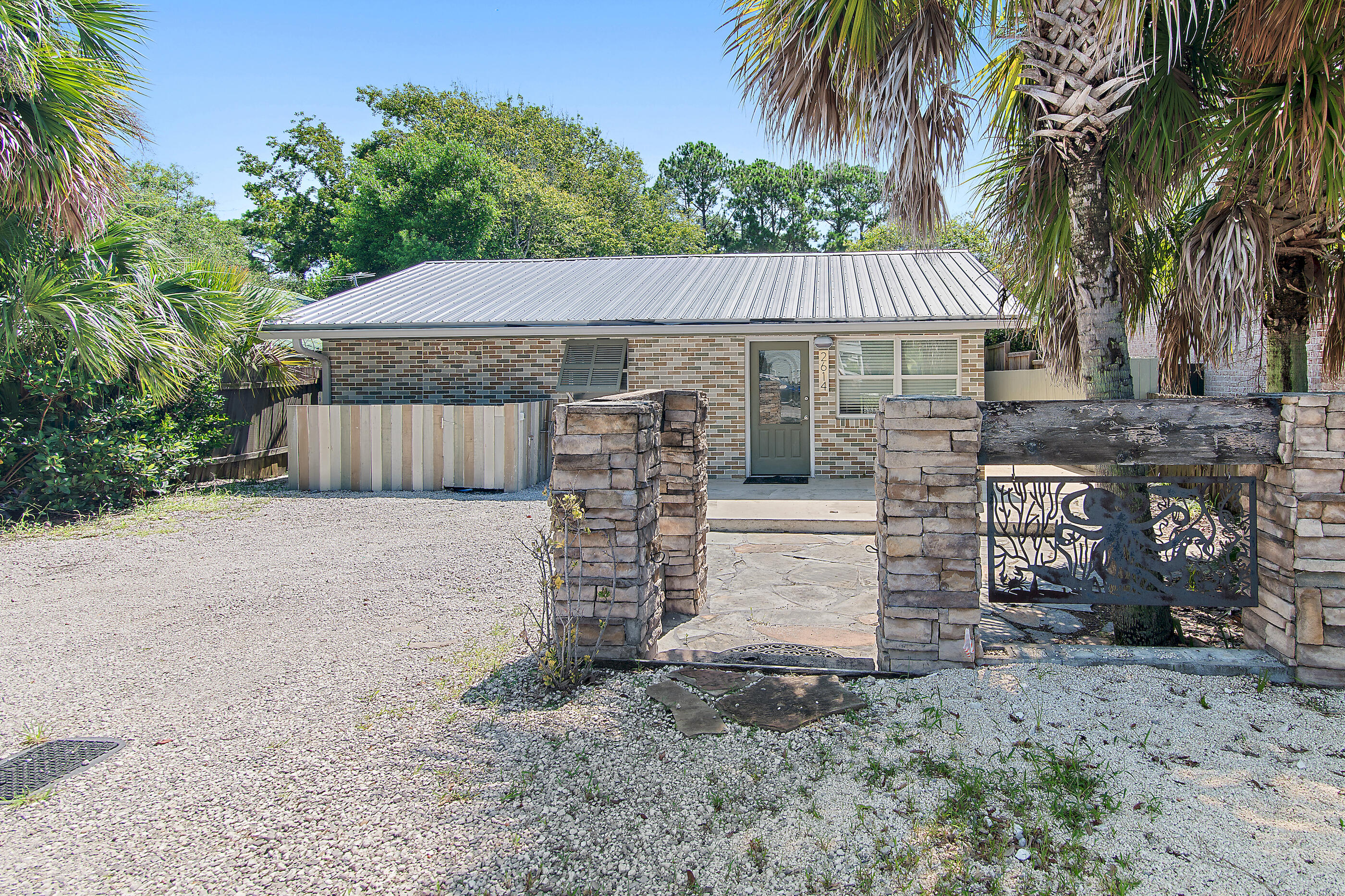 Quaint, classic Florida cottage, centrally located on W Hwy 30A in the historic community of Blue Gulf Resort. Short golf cart ride to Blue Mt Beach public park/beach access. Recently renovated inside and out. New metal roof, exterior paint. New cabinets, granite countertops, stainless appliances, are just some of the upgrades in 2021. New heat pump /handling unit 2023. Interior completely refurbished recently including brand new LVP flooring, built-in custom cabinets/shelving. 2 spacious bedrooms, plus a 3rd BR/ bunkroom. Crafted Baths, large walk-in closet off 
Main Bedroom.  Bonus Flex room allows for additional dining/den or workspace that opens onto private rear patio/fenced rear and side yards for bike, paddle board, beach gear storage. NO HOA! Must see!