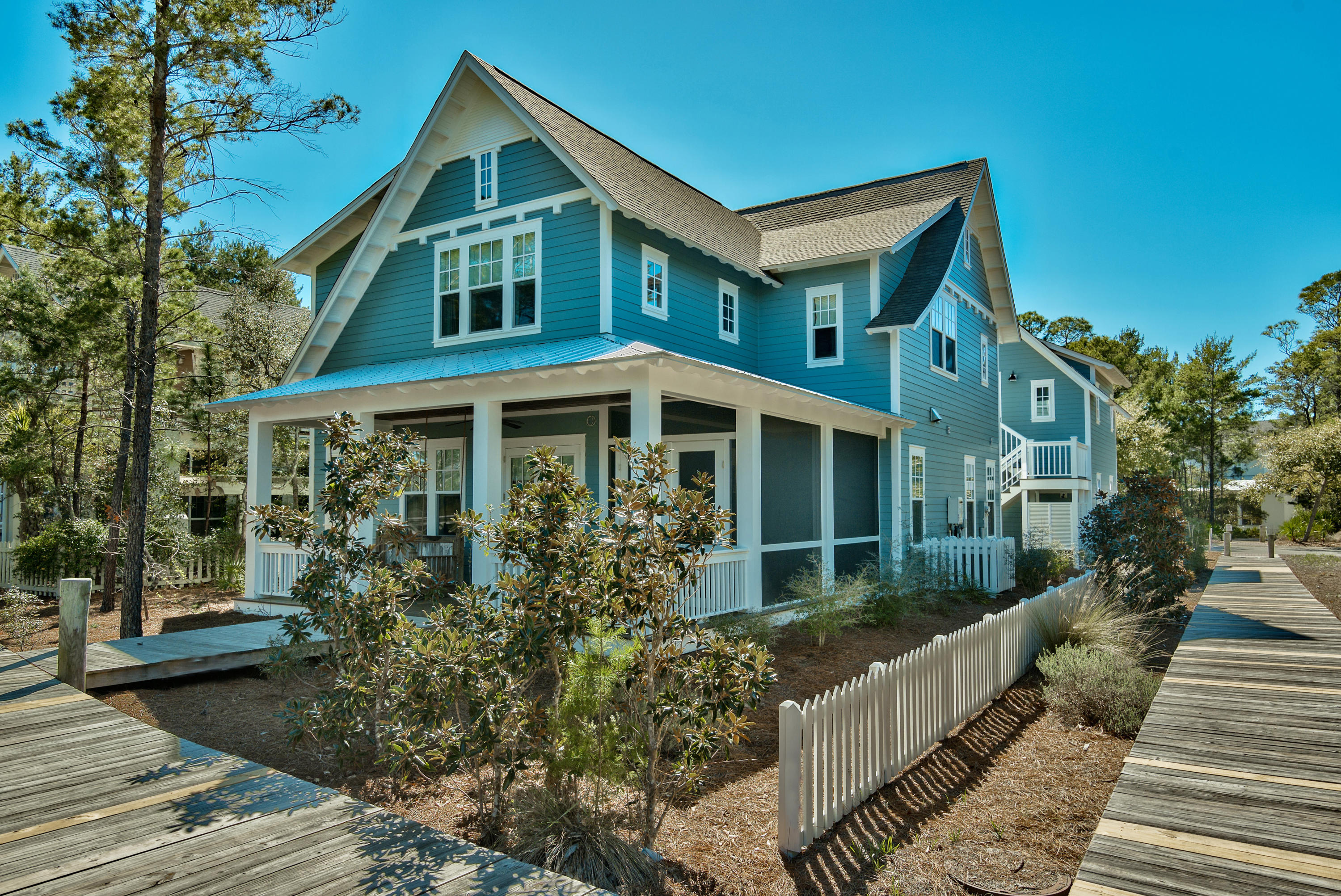Welcome to your perfect 30a beach home! Loaded with gorgeous designer finishes, accessories, and furnishings, it is ready to move in and enjoy! Located in the private gated community of Watersound West Beach, you will enjoy access to one of 30a's premier secluded beaches through Deer Lake State Park. Built in 2014, this home has never been rented, the exterior was just newly painted, and home was only lightly used by the owners--feels like a new home! It features 5 bedrooms, 5 and one half baths, additional upstairs living area & office, and a full carriage house with private entrance over the garage. With just under 3300 square feet, this is the perfect home for entertaining family and friends and there is room for everyone! The main floor has an open floor plan with beautiful kitchen boasting a large marble topped island, gas range, and upgraded appliances adjoining a beautiful light filled dining room that flows into the spacious living room.  A gorgeous gas fireplace is a focal point of the living area as well as french doors out to a porch with views of the lake.  There is also a private master suite on the main level that features a glamorous master bath with double vanity, large shower, and a spacious walk in closet.  A powder room and laundry complete the main level.  Upstairs, there is another living area, office with built-in desk, 2 guest rooms with ensuite baths, and a gorgeous master suite featuring a spacious bath, huge walk in closet, and views of the lake.  In addition to the lovely main house, there is also a private carriage house over a 2 car garage with it's own entrance.  The carriage has a combination living/kitchen, bedroom, and bath.  Watersound West Beach features a community pool/clubhouse, parks, boardwalks, security/gate, private boardwalk to the beach, and fitness center at Watersound Beach.