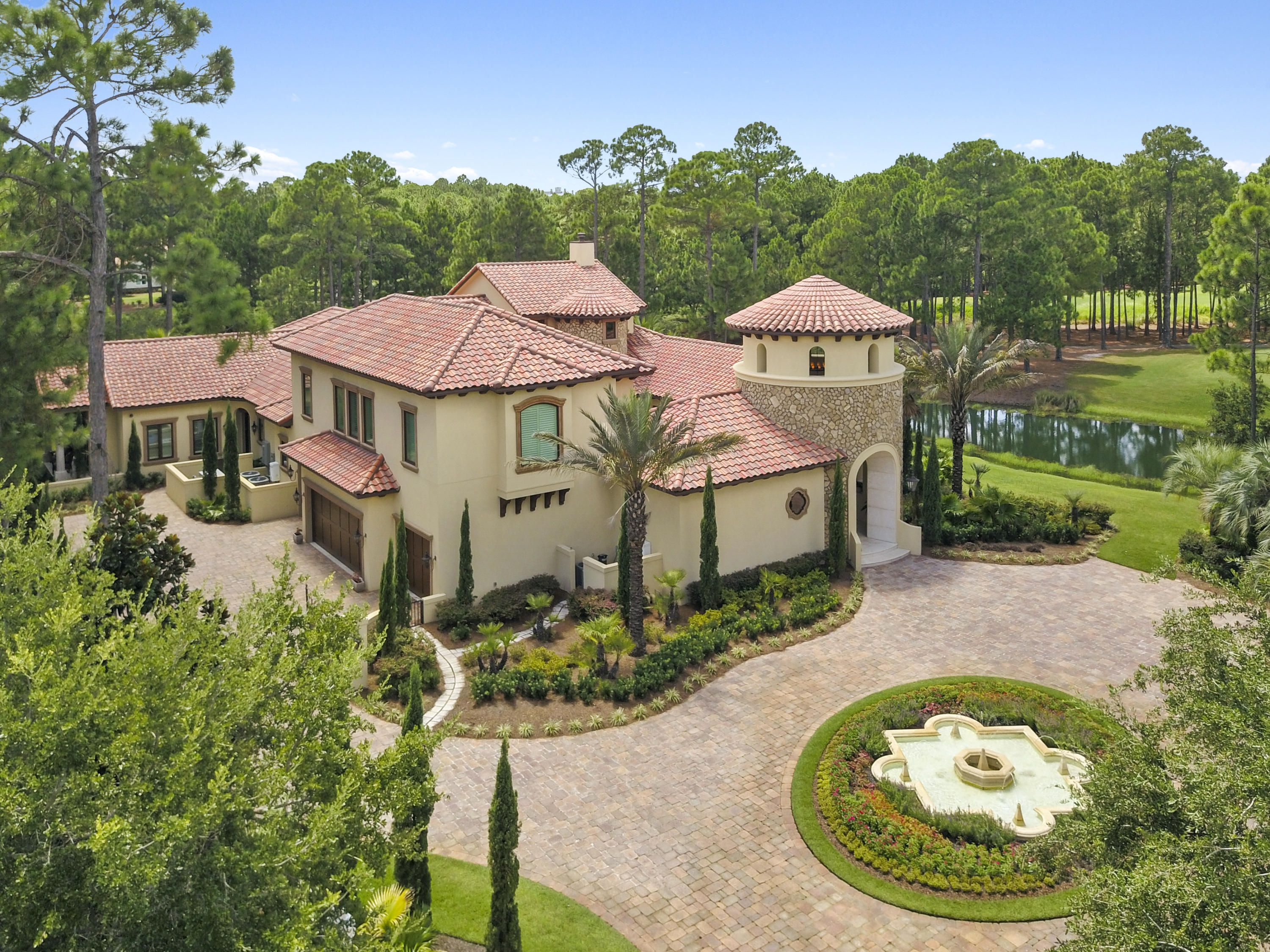 Magnificent custom luxury residence boasting over the top finishes, design & detail with an abundance of character for formal entertaining and gatherings. Beginning with the cathedral domed tower entrance flowing to the open air courtyard and extending throughout the entire home, there is absolutely no detail overlooked nor expense spared. This home features: chef's gourmet kitchen w/double islands, coffee bar, butler's pantry, climate controlled wine cellar with adjacent tasting area, elevator & more. Entertaining is a delight for you and your guests with the spacious dining room, game room, bar, and state of the art theater room. The outdoor living area is tastefully decorated in a casual Moroccan flair and includes kitchen, bar, bath, Mosaic tile pool, hot tub and fireplace. Master Sui is located on the main level and houses a spacious sitting area, fireplace, heated tile floors, and an abundance of closet space.  The office is strategically situated for privacy and comfort.  The in-law/guest suite is complete with a kitchenette and separate entrance.  Upstairs, a sitting area is nestled between 2 bedrooms, each with an en-suite full bath.  This one of a kind masterpiece is located on a large cul-de-sac golf course lot with lake views from every angle.  The gated entrance, surrounded by lush landscaping, make it the perfect private estate for the most discriminating owner.