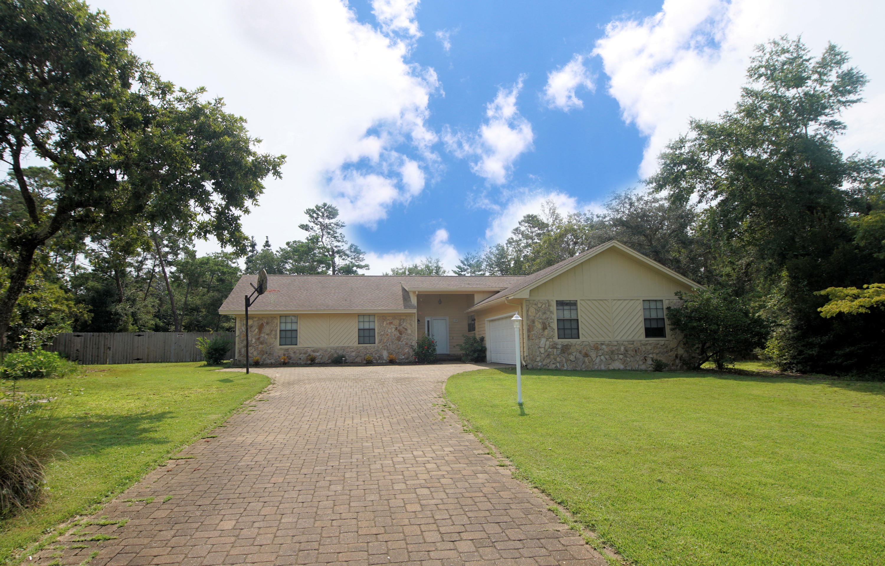 Ready for its New Owners! Brick 4 bedroom, 2.5 bath family home in popular Bluewater Bay Raintree Estates. Well maintained home on quiet cul de sac. Pleasing front elevation with paver driveway and side entry garage. Kitchen features newer stainless steel appliances. Jennair down draft range, quartz counters and adjoining table. Kitchen is open to the great room. Bonus room for office or crafts. 315 square foot addition (heated and cooled) provides added use flexibility. Outdoor hot tub off master bedroom. Owners Association {non mandatory) maintains nature trail immediately behind the property - which leads to a very large playfield for softball or soccer. Association also maintains a common use park area at the Bay with covered pavilion, grills,and newly constructed dock on the lake side Owners Association (VOLUNTARY) Membership $100 required to utilize the two Association owned Parks.  Association maintains 2 entrances, nature trail immediately behind the property - which leads to a very large playfield for softball or soccer. Association also maintains a common use park area at the Bay with covered pavilion, grills,and newly constructed dock on the lake side