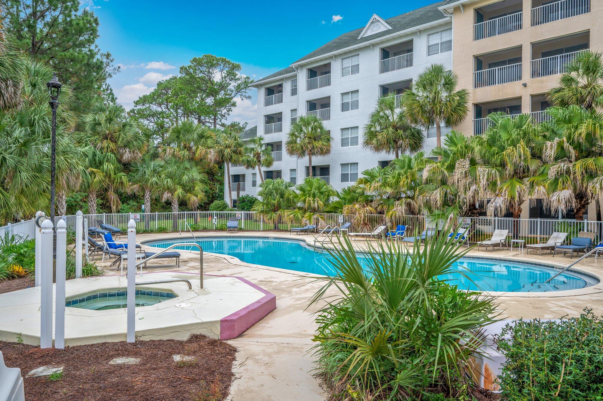 Welcome to this inviting top-floor, end unit condo at the well-maintained Florida Club at Bluewater Bay. This distinctive residence stands out with its soaring vaulted ceilings, while its end-unit position offers the advantage of an additional dining room window with an abundance of natural light not found in interior units. Step into comfortable living with practical wood-look tile flooring flowing seamlessly throughout the home. The updated kitchen features granite countertops and a stylish undermount stainless steel sink, perfect for both everyday living and entertaining. The bathroom continues the modern feel with matching granite finishes. Escape to your private screened balcony, where peaceful views of the sparkling pool and tranquil wooded pine landscape create the perfect setting for morning coffee or evening relaxation. An exterior storage room provides added convenience for your storage needs. The Florida Club's appealing amenities enhance your lifestyle with access to a refreshing pool, relaxing hot tub, well-equipped fitness center, and social spaces featuring grills and picnic areas. Elevator access ensures effortless living at every level. Perfectly positioned for both work and play, enjoy quick commutes to Eglin Air Force Base and weekend getaways to the stunning Emerald Coast beaches. This well-situated end unit offers the ideal blend of comfort, convenience, and Florida living at its finest.
