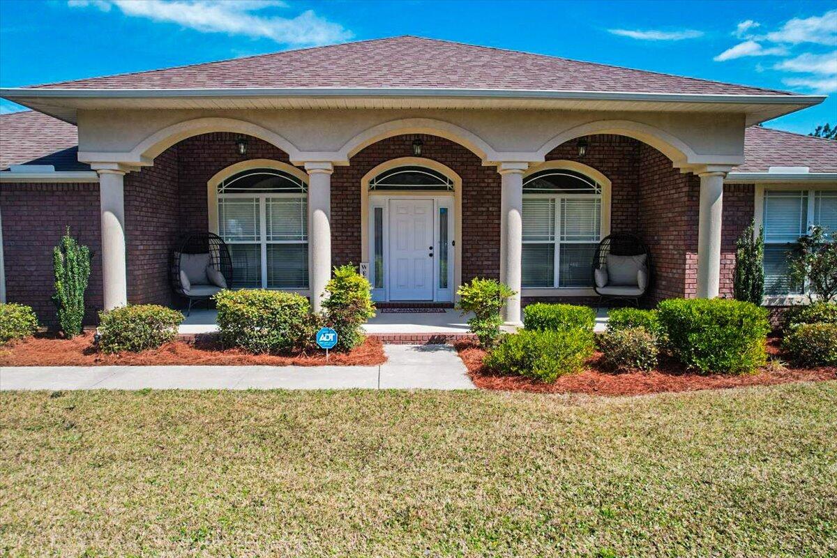 SELLER'S MOTIVATED! This beautiful pristine home offers an abundance of features and ample space, with a split floor plan with a large master suite with split AC and 3 additional well sized rooms to ensure privacy and comfort. The living room, florida room and kitchen with stainless steel appliances are massive and perfect for relaxing or entertaining family or friends. The covered patio is perfect for morning coffee. The large back yard is an open canvas for your imagination. With plenty of room for a pool and you have a large additional workshop. The propane powered generac generator ensures you are always prepared. With its blend of modern amenities, spacious living areas, and proximity to all you need. This is more than just a house, it's the perfect place to call home.
