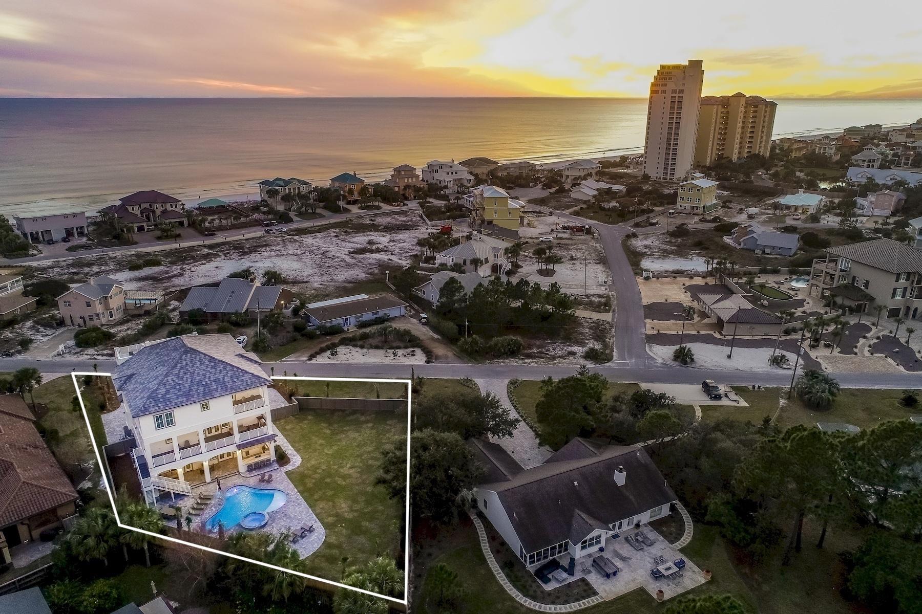 Newly completed in January 2019, this sleek coastal contemporary masterpiece is perfectly situated on over half an acre to capture 180 degree gulf views from each of the three finished levels as well as the fourth story rooftop deck.This property is comprised of over 9,400 square feet of total space with several expansive covered porches including a sun deck. Heated and cooled square footage is 5,980. This home is an investment magnate totaling over $300,000 in gross projected annual rental income. This is the ultimate beach home masterfully configured to provide unparalleled amenities and professionally decorated, designed & curated for entertaining with notable features including ample parking including two garage storage bays one of which accommodates a six person luxury golf cart that conveys with the sale complete with carbon fiber steering wheel, back up camera and Bluetooth radio. 

The exemplary open floor plan is characterized by optimal living space on each vertical level featuring a private living area accessible by surrounding bedroom suites. There are two outdoor kitchen areas located on the first and second floor and fully equipped for entertaining with covered built in gas grilling areas, big screen television and ample seating. The first floor offers a spacious game room with full wet bar flowing seamlessly to the outdoor living and subsequent private resort style pool area as well as an adjoining spa and covered outdoor summer kitchen & living area with gas fireplace. Other notable features include multiple indoor and outdoor living areas, private commercial grade elevator, dual master suites with gulf views and adjoining spa like bathrooms with floor to ceiling tile, built-in pinterest style bunkbeds, indoor and outdoor surround sound system as well as a whole home security system.

The first floor layout boasts a spacious bunk room complete with four queen bunk beds as well as a large first floor master suite with king bed and queen bunks with both bedrooms offering adjoining baths as well as a central living room and adjoining game room with pool table complete with a built in wet bar including an ice maker. The second floor is the focal point of indoor living space with a spacious living room framed with beamed ceilings, floor to ceiling windows to soak in the beautiful gulf views, gas fireplace, dual built-in entertainment centers and open to the massive dining area overlooking the rear amenities. The ample sized kitchen features floor-to-ceiling custom cabinetry, side by side stainless refrigerator/freezer, two sets of double ovens, Wolf professional series gas range, dual dishwashers and side entry pantry and large center island with gorgeous quartz custom countertops. The second floor also features a full bedroom with ensuite bathroom & powder room as well as access to the second story outdoor dining area complete with full outdoor kitchen and stair set overlooking the lagoon style pool. The third floor features 3 full bedrooms including dual master suites, oversized laundry area as well as built in bunks for additional sleeping ability. There is also an owner's closet and gorgeous media room. 

Gulf pines is an exceptional private neighborhood nestled south of highway 98 perfectly located along the Gulf of Mexico in Miramar Beach, adjacent to the Sandestin Resort. The beach at Gulf Pines is hardly ever crowded with approximately 1,300 feet of magnificent gulf front for your enjoyment in this low density neighborhood with private / gated beach access exclusive to owners and owners guests. Gulf Pines has a sizable gulf front pavilion with seating and tables on almost 100 feet of beach for your pleasure and comfort. Golf cart transportation is permitted in this low density neighborhood and this home has one of the finest, new 6 passenger LSV carts around to conveniently park at the beach. Also, there is a beautiful lake within Gulf Pines, which is perfect for fishing.