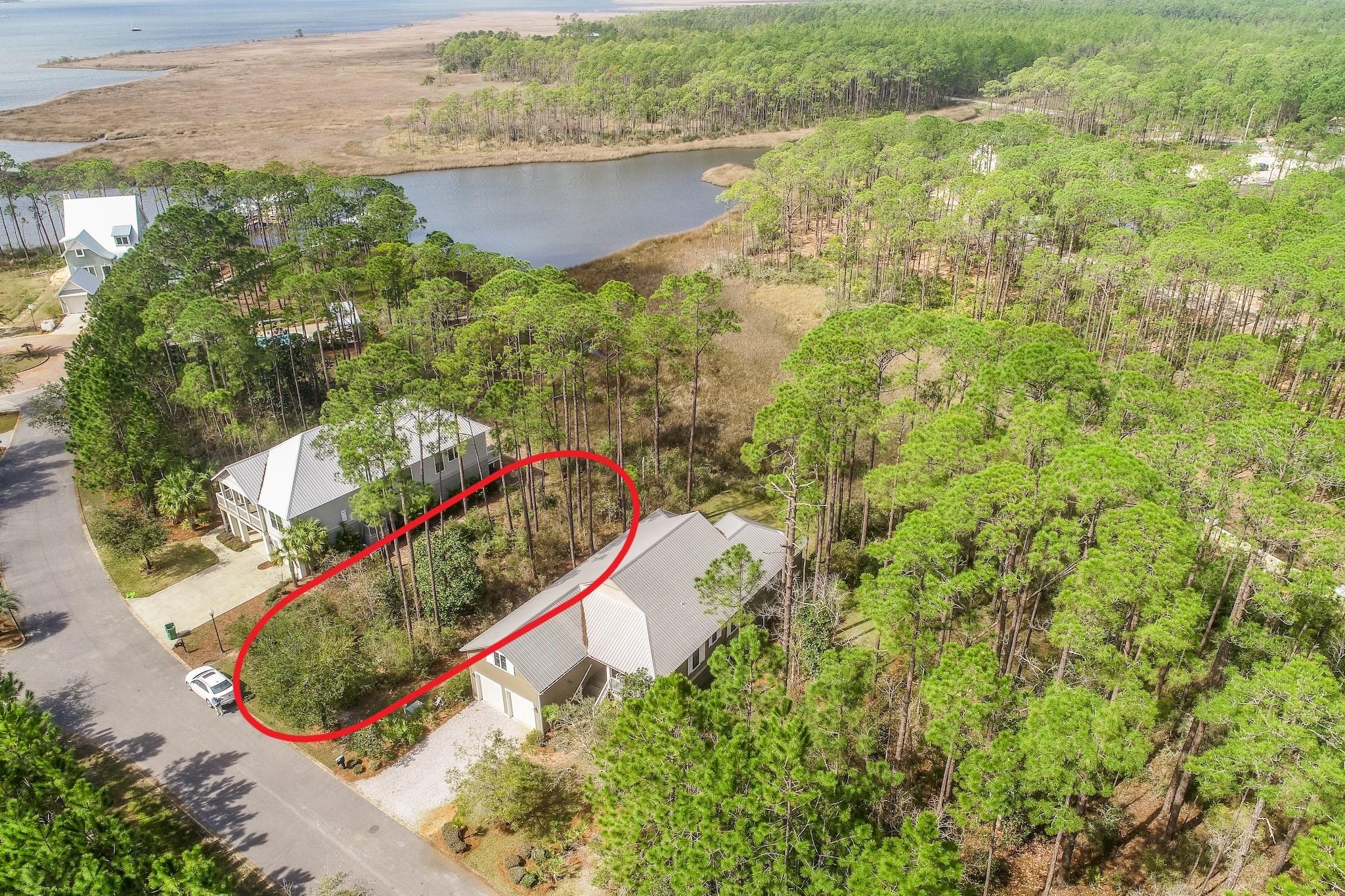 Prime vacant lot bordering Hogtown Bayou! This .26 acre lot backs up to natural protected wetlands, ensuring privacy with no further development behind. Enjoy stunning views and sunsets of the bayou and build your dream home in a tranquil setting! Cessna Landing is private, gated community in the heart of Santa Rosa Beach just a short distance from the Cessna Landing Park and boat launch. There is a beautiful community pool just a few steps from your door. The large sundeck is perfect for relaxing, and even offers a covered portion when you want to get out of the sun. Just behind the pool is a community dock, perfect for fishing or launching a paddle board or kayak for water adventures. The home next door at 159 Mallard is also for sale. The combined lots total over 1/2 an acre! This lot can be the perfect addition to the existing home next door for added privacy, a carriage house, entertainment area, pool or expansive yard. Otherwise, this is a great location to build being that it is a still a large lot totaling over 1/4 acre!

Cessna Landing is just minutes away from Sacred Heart Hospital, and the shopping and dining available at Grand Boulevard and Baytowne Wharf. Being off of N Highway 393 you are also close to the beautiful beaches of South Walton and the legendary 30-A area, a famous recreational gem on the Emerald Coast. Hogtown Bayou connects to beautiful Choctawhatchee Bay so there is plenty of waterways to enjoy and explore. Don't miss the opportunity to own this amazing waterside lot in a very quiet and scenic community!