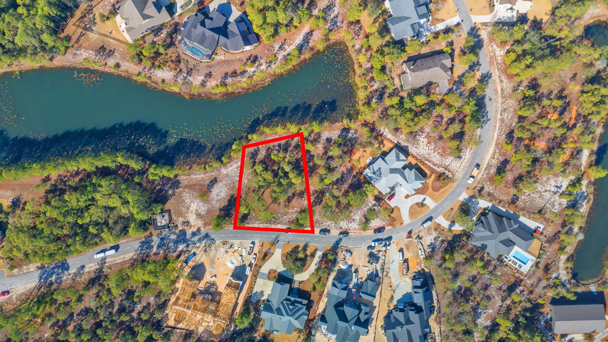 Serene wooded lot with pond in rear.  Price includes ARB approved plans designed by renowned architect, Pure Architecture, for 3452 sq ft, 3 bed/3.5 bath home with master on the main + study + formal dining + craft room.  Plan was designed with full time living in mind.  

Wild Heron is a beautiful gated community along Lake Powell, the largest coastal dune lake in the area.  Homes are rich in Craftsman styled architecture, perfectly complimenting the nearly 1,000 acres of incredible native Florida scrub, lakefront, wetlands, walking trails, and pristine golf course which define the community. Homes are rich in Craftsman styled architecture, perfectly complimenting the nearly 1,000 acres of incredible native Florida scrub, lakefront, wetlands, walking trails, and pristine golf course which define the community.  Amenities are bountiful and include community pool + hot tub, parks, gazebo, boat house with kayaks available for homeowners, firepit, boardwalks, marina with limited boat slips, and a fitness center overlooking Lake Powell.

Nearby:
10 mins to 30A
12 mins to Rosemary Beach
20 mins to Pier Park