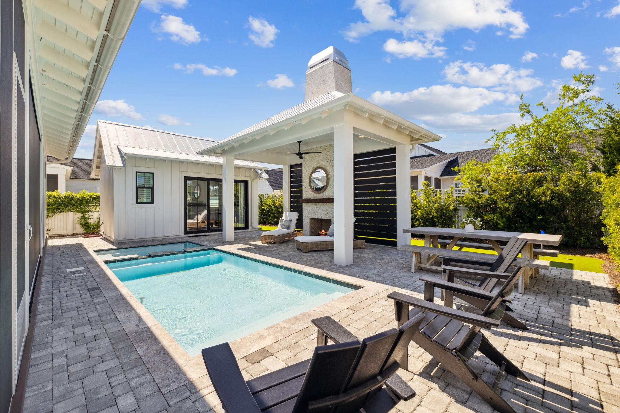 Be prepared to be amazed at 277 Catface Dr in the highly sought-after Watersound Origins neighborhood, where your first impression of a typical Romair-built Suffolk plan is just the beginning of the journey. Step inside & prepare to be impressed by this extraordinary 4-bedroom, 4.5-bath home that blends custom luxury with functional design. With a BONUS ROOM & **POOL HOUSE**, this home is truly one-of-a-kind! As you enter, the front bedroom offers versatility, functioning as both a guest room & an office with custom-built-ins & double closets, perfect for your home workspace. The chef's dream kitchen features a grand center island with paneled Thermador appliances, including a 48'' gas dual oven, 6 burners, and a griddle. Custom cabinetry with farmhouse drawers replaces traditional cabinets/shelving for added convenience. The expanded dining area comfortably accommodates a table that seats 6+a thoughtful upgrade from the original design.
The spacious living room centers around a cozy fireplace, flanked by custom-built cabinets and shelves for displaying cherished family photos and treasures. The laundry room doubles as a mudroom and features a stackable washer/dryer, farmhouse sink, hidden cabinet with an ironing board, and even a 96-bottle wine fridge for the wine enthusiast.
The primary suite is an elegant retreat on the first floor, featuring French doors that lead to the screened porch. It also boasts an en suite with dual sinks, a walk-in shower, and a large closet. Upstairs, you'll find two additional bedrooms, each with its own en suite bathroom, complemented by stylish barn doors. The oversized bonus room is ideal for a kids' playroom, a game room, or flexible space for your needs. This room is also home to the whole-house Sonos AV system in a dedicated closet, making it a perfect entertainment hub. Custom California Closets are featured in every bedroom for optimal organization, and one of the upstairs bedrooms even offers access to a 500 sqft attic space for easy storage.
As you step into the backyard oasis, you'll experience something truly unique. The Nanawall sliding doors open wide to seamlessly blend the indoor and outdoor living areas. Relax on the electronic screened porch or entertain guests at the summer kitchen, complete with a 42" Artisan grill, ULine icemaker, Instahot faucet, and beverage refrigerator. The saltwater pool and spa are surrounded by elegant paver decking, leading to a pavilion with a fireplace, wood mantle, and a slatted wall for added privacy. This space is designed for ultimate relaxation and entertaining with plenty of seating, lounge chairs, and dining options.
The standout feature of this backyard is the one-of-a-kind pool house, which includes a full bath and is currently set up as a bedroom but could easily serve as a family entertainment area, complete with room for a pool table or ping pong. With its own split HVAC system, guests can enjoy customized comfort. The backyard also features a turf putting green, perfect for golf enthusiasts. Paver walkways along both sides of the house lead to the pool equipment and the front of the house.
Additional highlights include 3-zone AC on the second floor and 2-zone AC on the first floor, ensuring efficient climate control throughout the home. Plantation shutters on all windows add an elegant designer touch. The garage features a fusion wall system and California Closet cabinetry for the ultimate garage organization. In addition there is a whole house Generac Generator for peace if mind.
Don't miss the opportunity to make this exceptional home yoursit's a true masterpiece that checks every box for luxury living and outdoor entertainment!