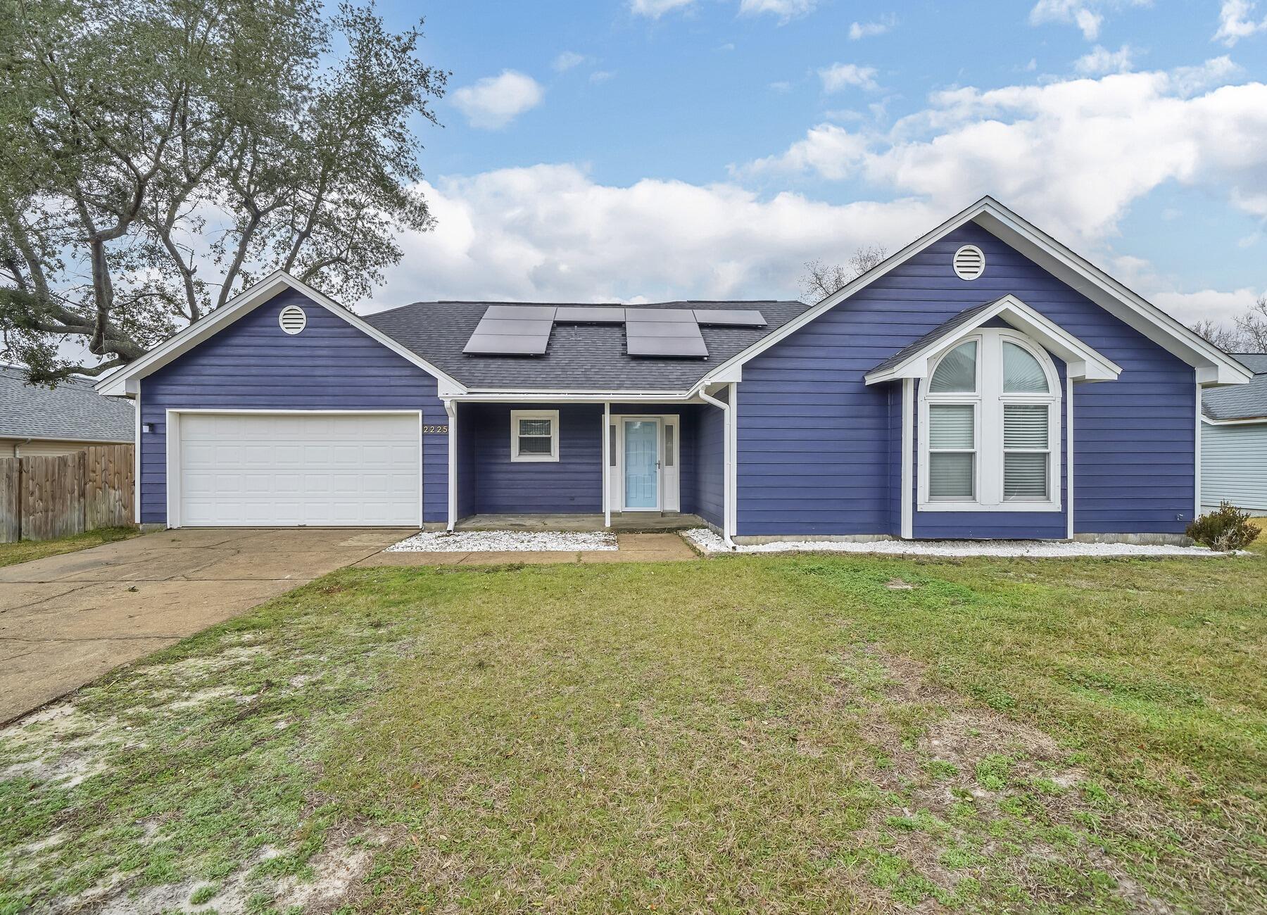 AVAILABLE... April 14, 2026!! 3bd/2bth home located in East Navarre for a quicker commute to Hurlburt Field AFB! This charming light blue home boasts solar panels and upgrades throughout the entire home! The home features a fully fenced yard, a double car garage, stainless steel appliances and a corner fire place in the family room. The back doors exit to an amazing deck space for entertaining and grilling out. NO smoking. Pets allowed upon approval with a non-refundable pet fee. NO smoking. 600 minimum FICO credit score required in addition to meeting rental criteria. Pets allowed upon approval with a non-refundable pet fee.

All applicants are required to complete an application on https://onefamilypropertyservices.petscreening.com/ regardless of if they own a pet or not.   Applicants with an ESA are also required to complete the application.
**Please note, only one pet profile per pet is required.

** Fees Required once an application is approved include, but may not be limited to: Security Deposit, Non-Refundable Fees (cleaning and rekey), $20 Certified Mail Fee, and Pet Fees (when applicable).