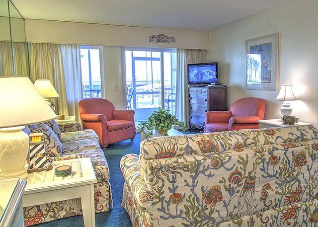 Step inside this ground floor, quaint 2 bedroom condo located just steps to the white sands and the Gulf of Mexico. No waiting for elevators, just open up your patio door and walk across the green space to the beach boardwalk! Enjoy the beautiful beaches of Destin from this condo featuring tile in the kitchen and bathrooms along with beachy decor. Holiday Surf & Racquet Club has tennis courts, shuffle board, boardwalk, his and hers exercise rooms, beautiful lobby, landscaping throughout the complex and game room. Do not miss out on this condo with fantastic rental potential!