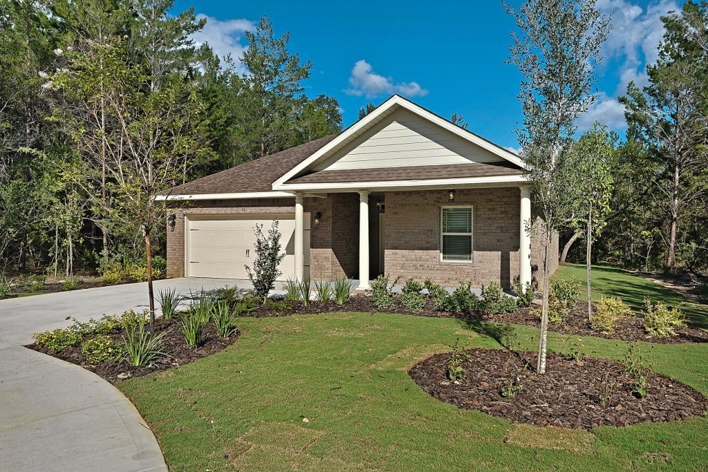 Come buy our CAITLYN under construction in our Hammock Bay community located in Freeport FL. The CAITLYN offers 1869 SF of relaxed living space with a very open plan including 3 bedrooms and 2 baths. As you enter the home from the covered front porch the foyer leads to a hallway with the two secondary bedrooms. Continue to the oversized Great room which flows in to a Dining area and the open Kitchen. The Kitchen has tile floors, granite countertops, plenty of 42 cabinets and an island. The Master suite is a large bedroom and bath with double sink vanity, large shower and walk in closet. Boasting luxurious finishes and detail the CAITLYN is a versatile and beautiful home.
