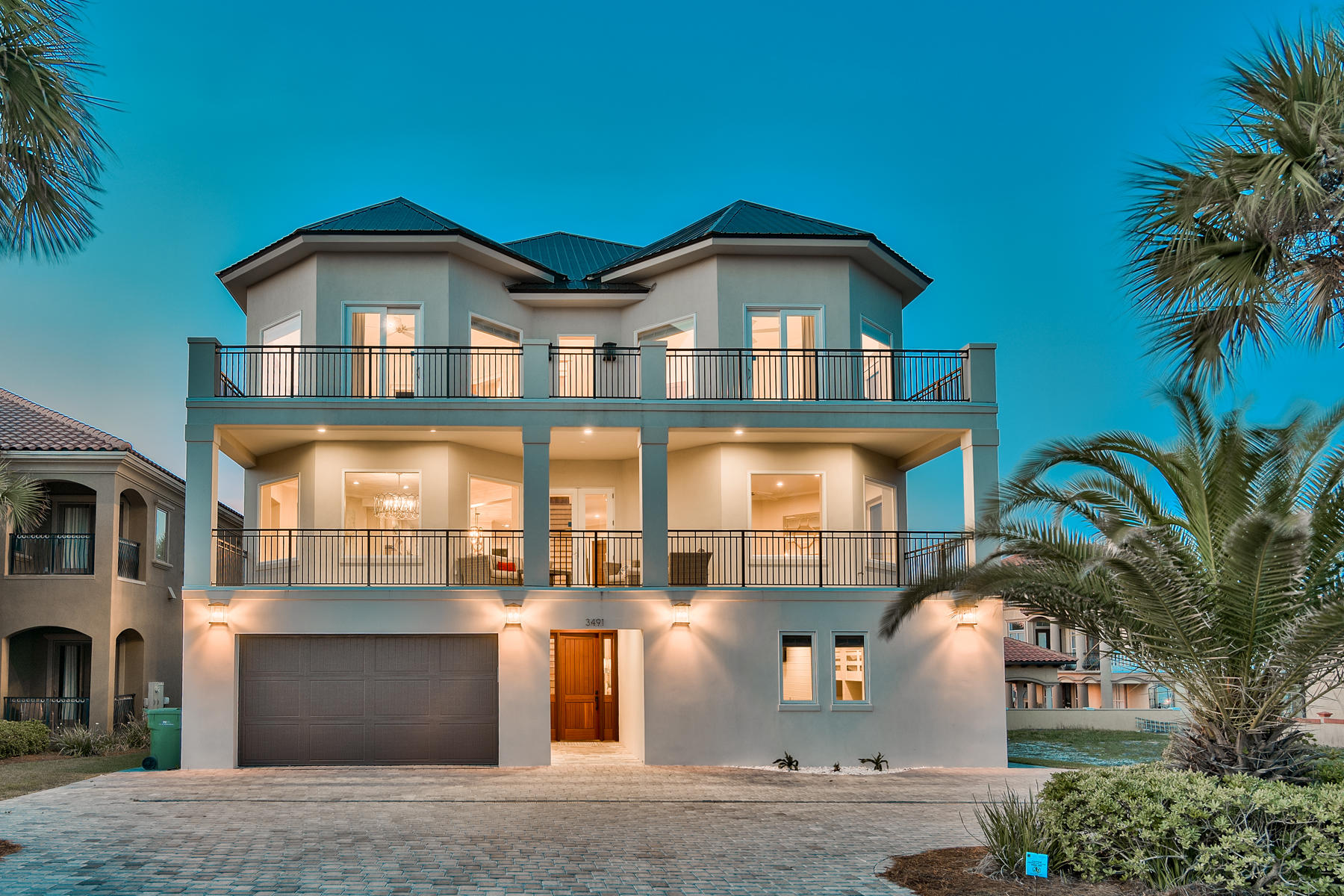 Newly renovated and professionally designed & curated, this sleek coastal contemporary masterpiece is primely situated to capture extraordinary unobstructed gulf views. This is the ultimate beach home ideally situated on the easternmost lot in Grand Palms overlooking the county owned beach frontage; masterfully configured to provide unparalleled amenities and built to last with fortified insulated concrete construction. This exemplary retreat boasts incredible rental potential offering +$338,000 projected annual income. The layout has been thoughtfully configured to maximize functionality offering ample exterior parking in addition to an oversized two car garage. Notable features include a watermark-built private resort style pool area complete with a covered outdoor summer kitchen & living area with bar seating and outdoor television. There are multiple indoor and outdoor living areas, private commercial grade elevator, dual master suites with exceptional gulf views and adjoining spa like bathrooms with floor to ceiling tile, ample windows, indoor and outdoor surround sound system as well as covered porches on the south elevation allowing for endless gulf vistas. The first floor layout boasts dual bunk rooms, as well as two large bedrooms and adjoining baths as well as a comfortable family room just off the pool deck offering a wet bar and lounge. The second floor is the focal point of indoor living space with a massive open living room featuring panorama glass windows for soaking in gulf views, custom entertainment center and open to the massive dining area facing due south. The ample sized kitchen features floor-to-ceiling custom cabinetry, Sub-Zero appliances and Wolf professional series gas range, walk-in pantry and large center island with gorgeous quartz custom countertops. The second floor also features two full bedrooms with ensuite bathrooms & half bath as well as a spiral staircase access to the outdoor dining area and resort style pool. The third floor features three full bedrooms including dual master suites each featuring soaring 14' vaulted ceilings with pristine gulf views, laundry area and massive open porches offering eastern and western views. This home is well positioned to enjoy all of the world class beaches along scenic highway 98 as well as Destin's restaurants, shopping, dining and outstanding local entertainment. Grand Palms owner's enjoy all of the amenities of Destiny S/D including the community pool area, clubhouse, tennis courts and community grounds.