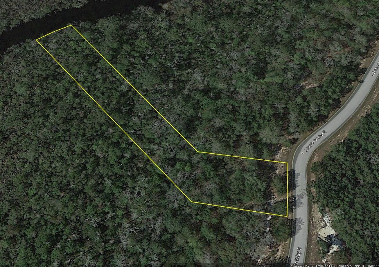 Beautiful estate size waterfront lot backing up to Godwin Creek in the gated community of Magnolia Bay Estates, a 79 lot subdivision of which 26 are waterfront, with access to Alaqua Bayou, Choctawhatchee Bay and the Gulf of Mexico. Conveniently located to the booming town of Freeport, Hammock Bay, shopping, restaurants and only 20 minutes to Hwy 30A and the crystal sandy beaches of the Gulf of Mexico. Water, sewer tap, and utilities are at site ready to build the house of your dreams. Additional waterfront lot is available. All Information is deemed reliable but not guaranteed with the buyer to verify. Seller financing with flexible terms is available with adjusted pricing. Craft two home sites for your family or keep the other lot as an investment. You must visit these properties in person to take in the beauty of the vista. Erect a dock on Goodwin Creek and launch your boat or drop a fishing line to while away the day and maybe catch dinner. Perfect Location, Exceptional Investment Opportunity. Situated in a quiet, tranquil neighborhood, these properties are investor's dream. 
Convenience Amidst Nature's Best
Only 7-10 mins from downtown Freeport and close to the following points of interest:
Dining/Restaurants: 7-15 minutes - Bubba Jacks, Taco Bell, Waffle House, McDonalds, El Jacalito Mexican Restaurant, Dairy Queen Grill & Chill, Li's Hot Wok Chinese Buffet, The Oar House & Oyster Bar
Historical Landmarks/Parks/Recreation: 5-10 minutes - Old Town Freeport, The Heritage Center of Freeport, Harry A. Laird Park, Prospect Park, Riverwalk Landing Cottages & RV Park, Fisherman's Boatyard, Alaqua Watersports, Chain Dragon Disc Golf Course, Freeport Regional Sports Complex
Supermarket: 8-10 minutes - Publix
Beaches: 30 minutes - Blue Mountain Beach, Grayton Beach
Hardware and Auto Parts Stores: 10 minutes - Ace Hardware, O'Reilly Auto Parts, Advance Auto Parts, B & M Tire Center
Schools: 5-10 minutes - First Steps Learning Academy, Freeport Middle School, Freeport Elementary School
Storage Facilities: 6-12 minutes - Move It Self Storage, Freeport Mini Storage