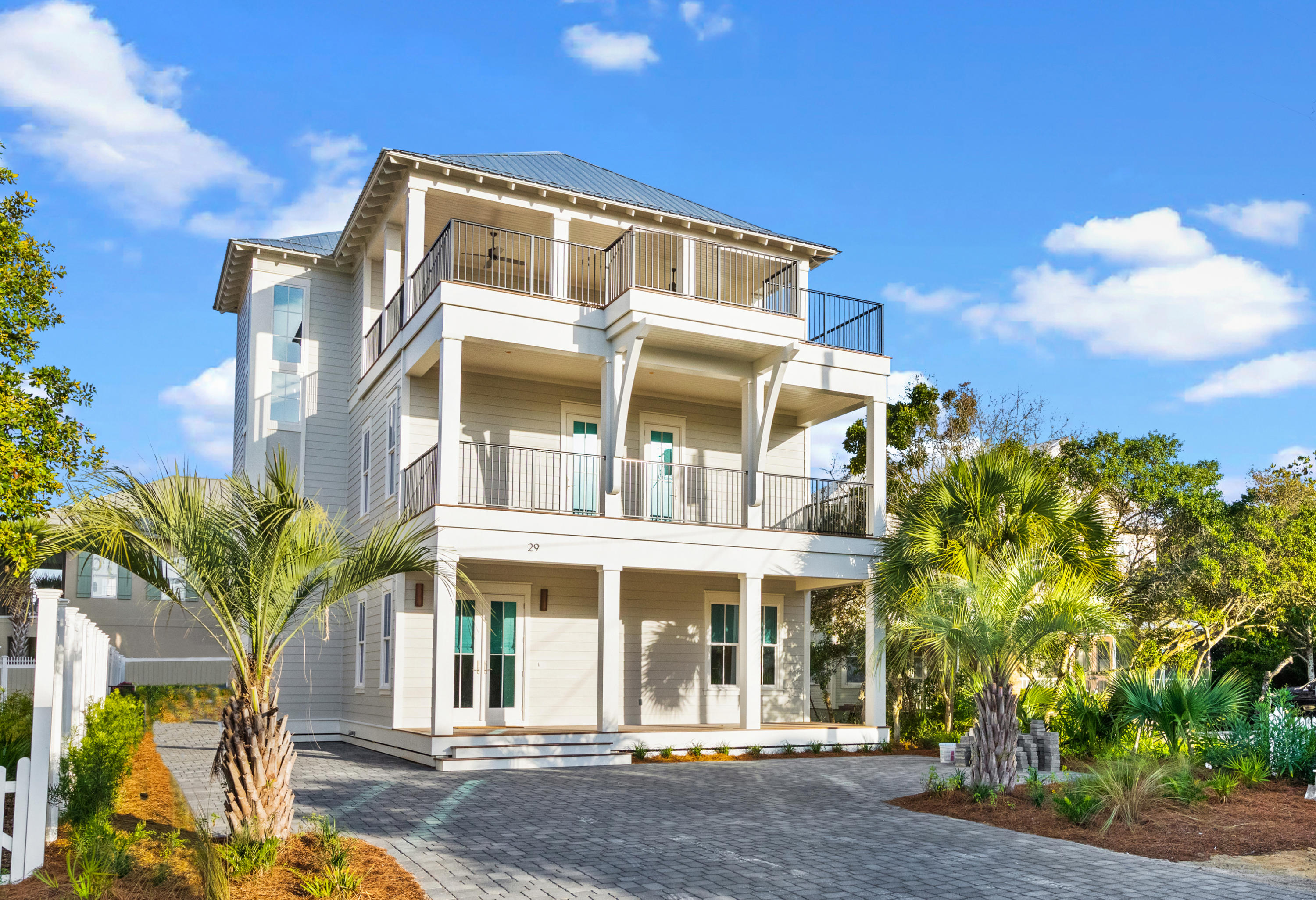 Coastal luxury at its best in this newly constructed retreat perfectly located in the heart of Seagrove Beach, less than a mile to Seaside and some of the most celebrated dining, shopping and entertainment options 30A has to offer. Best of all deeded beach access just a few steps away guarantee sandy toes in just minutes.
Thoughtfully designed to take full advantage of the amazing gulf views enjoyed from both the east and the west, this highly desirable open floor plan is sure to impress with 5 bedrooms, 5 full baths, 3 half baths, multiple living and gathering spaces, private pool and some of the most amazing outdoor entertaining spaces offered along the Emerald Coast. Gorgeous custom stained oak floors, quintessential shiplap, and an abundance of natural light offer a stunning welcome into the grand foyer.  A sizeable king retreat is conveniently located on the first floor boasting more than enough space to unwind and relax and a perfectly finished private ensuite. Continuing into the heart of the home, the oak floors and shiplap lead to the expansive great room, perfect for gathering loved ones with an impressive chef's kitchen complete with custom shelving, large center island, beautiful countertops, high end appliances, and an elegant backsplash. This is the perfect spot for entertaining with the large living and dining rooms both flowing from the kitchen. Open the large glass doors, let the ocean air in, and watch the sunset while enjoying the gorgeous private courtyard retreat; complete with pool, outdoor kitchen, and plenty of room for sunbathing or dining al fresco. A huge walk-in pantry, half bath,  pool bath, and a conveniently placed elevator are also found on the first floor.

The second floor offers an additional living space with comfy places for watching television or playing a game, a coffee bar with built in fridge offers your guests fresh coffee as the sun rises. The largest of the king retreats is found here on the second floor, with a private sitting area and large ensuite featuring beautiful Carrara marble, soaking tub, double vanity, impressive walk-in shower, and master closet. A grand and private deck to take in the sunset and enjoy the crisp ocean air solidifies the suite's desirability. You'll also find the ever-so-popular bunk room with full-over-full custom bunks and private ensuite and a 3rd comfortable king retreat with beautiful ensuite. Both rooms offer access to a large east facing deck. The oversized laundry room boasts several closets, utility sink, and an abundance of counter and cabinet space for all the storage needs of the home. 

As you enter the 3rd floor you'll immediately feel the need to open the large doors and step out onto the oversized party deck and take in the crystal blue views of the Gulf of Mexico. The possibilities for this space are endless. The entertainment room and large deck will most certainly become a favorite meeting place for all. A wet bar houses all the essentials needed to ensure that the fun will go on...

The 3rd floor master retreat provides some of the most amazing Gulf views of the home; enjoyable from the large and private deck. Watch the sunset or listen to the waves from the privacy of this special retreat. The ensuite offers the much expected double vanity, ]soaking tub, walk-in shower, and master closet with a most unexpected level of finishing. 

Seller is offering designer furnishings that have been beautifully and meticulously selected. GOLF CART INCLUDED! This estate will make the perfect second home or primary, permanent residence. For those looking for a solid investment opportunity, the rental projections come in strong just under $200K. Showings now available.