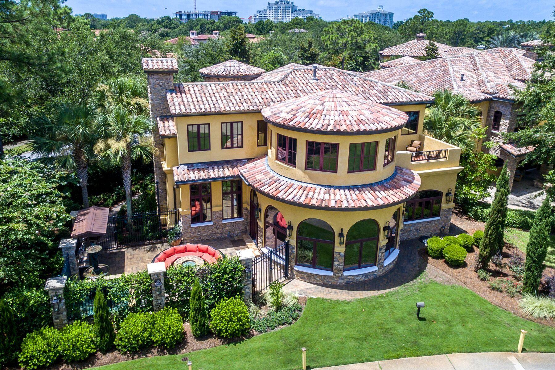 Exquisite detail in this unique, memorable, low maintenance Tuscan Villa in Sandestin. Located on the 12th fairway of Raven golf course, the spectacular views are maximized from window-wrapped circular rooms and beautiful outdoor living space. Ideal for entertaining large groups, this home has 2 large kitchens featuring granite counter-tops, custom cabinetry, Viking appliances, warming drawer, and breakfast bar. The second kitchen is equipped with a 13' commercial grade Twin Eagle tepanaki grill, Twin Eagle BBQ grill, and Twin Eagle 60,000 BTU burner with high grade Stainless Steel and LED lighting. The custom wine seller with cooling system would please any wine collector. Beautiful finishes include: natural stone and distressed wood flooring, custom wood doors and iron work, stone and marble fireplace, and custom faux finish paint throughout. Beautiful upstairs master suite with spacious circular "Florida room" with private balcony, piano room, and large walk in closet.  In addition, this home features a whole house generator, Sonos sound system throughout, digital LED lighting system, 3 dual-compressor high efficiency A/C units, 4 fireplaces, piano room, and more. Sandestin Golf and Beach Resort is named the #1 resort on Florida's Emerald Coast.  Spanning over 2,400+ acres, this resort is comprised of over 70 unique neighborhoods of condominiums, villas, town homes, and estates. The resort features miles of sandy white beaches, four championship golf courses, a world-class tennis center with 15 courts, 4 resort swimming pools (and 15 private neighborhood pools), a 113-slip marina, a fully equipped and professionally staffed fitness center and spa, meeting spaces and The Village of Baytowne Wharf, a charming pedestrian village with events, shopping, dining, and family entertainment.