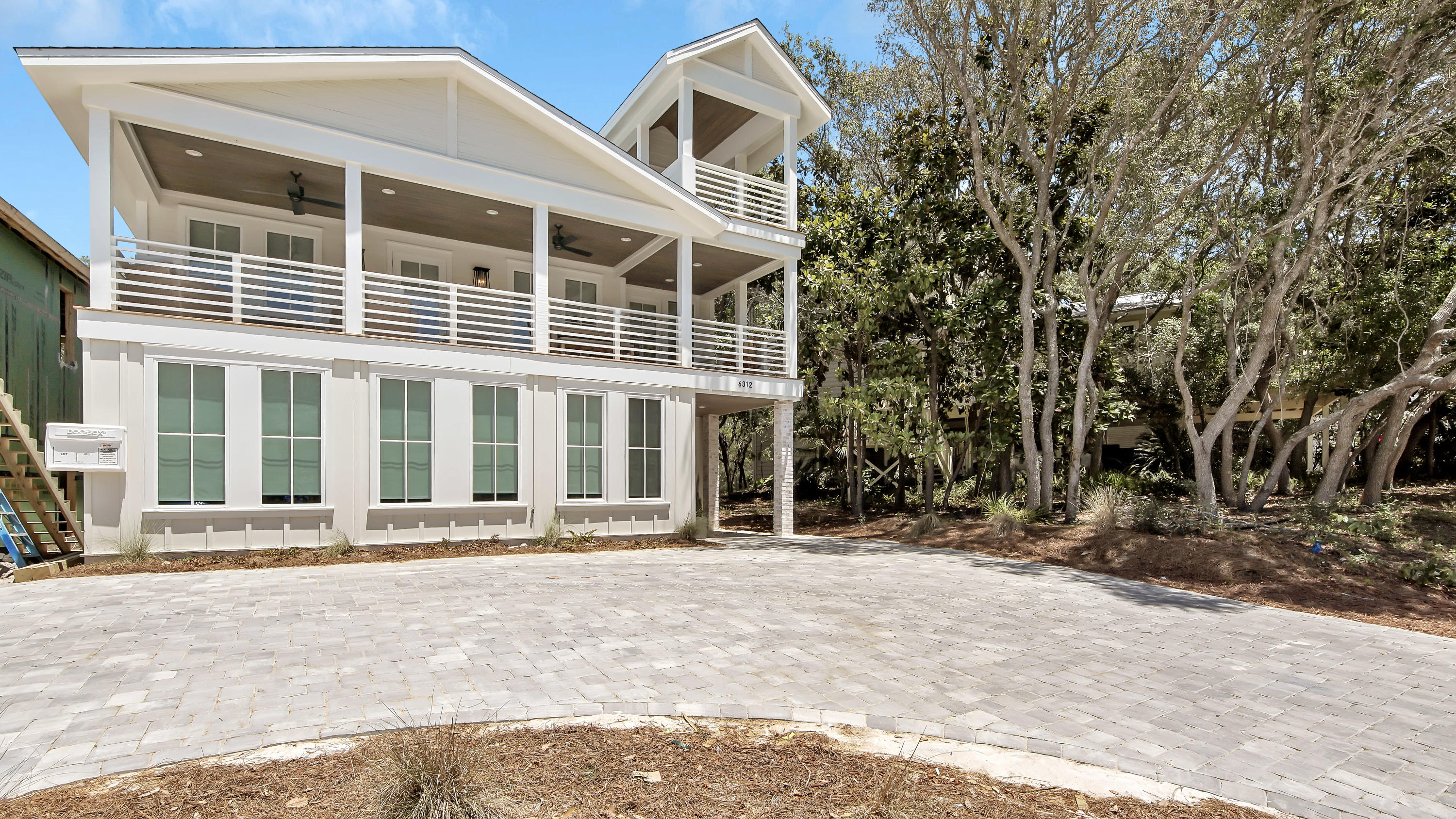 Stunning coastal construction is discovered in this beautiful beachside manor. Boasting seven bedrooms and a remarkable amenity package including a private resort style pool, 6312 W County HWY 30A is a well-equipped and carefully crafted home that seamlessly combines luxury design with seaside charm. Situated on the west end of 30A, less than a tenth of a mile to the beach, this property offers quick access to the sugar white sands and emerald waters of the Gulf of Mexico as well as to the high-end shopping and world-class dining found along the area. Sitting on a quiet quarter acre parcel, this home offers serenity while still being within close proximity to all of the action! Features of the home include a large open concept living space; a chef's kitchen including oversized gas range; wood floors throughout; custom trim work; shiplap throughout, exposed brick; solid core doors; marble tile; designer finishes and luxury fixtures. The well-planned floorplan creates the perfect space throughout the home for the entire family to enjoy. 
 
As you enter the home you are greeted by the grand stairwell in the foyer. Through the ground level vestibule you gain access to the recreation room which opens up directly to the incredible outdoor living space. On this floor you will locate 2 guest suites each including on-suite bathrooms; a large bunkroom with custom bunk-beds; an additional full bathroom; and a large laundry room. As you exit the home in the rear you will discover the ultimate outdoor space featuring a resort style pool, fire feature, summer kitchen and open-air shower. The property is highlighted by lush landscaping containing space for bocce ball, sand volleyball and corn hole! 
 
Climb from the ground floor to the main level of the home. As you enter the second floor you are welcomed into the stunning great room. This space is highlighted by the impressive vaulted ceiling and exposed brick. Here you will also find the large living space, spacious dining room and chef's kitchen with large island. On this level you will also discover the master suite as well as an additional guest suite. Off the living room you, enjoy the large front porch overlooking 30A. The second floor of the home also grants access to the home's viewing tower. 

The carriage house offers is currently under construction with a completion date of August 2020. The detached structure features an additional fully equipped kitchen, spacious living space, a guest bedroom, a guest bathroom and a private master suite over-looking the pool. The oversized 2 car garage offers an additional laundry center and gaming area. 
 
Impressive rental income potential create the perfect investment opportunity. Given the location and layout this home would make the ideal second home or permanent residence. Do not miss the chance to make this property your own, at this price it will not last long!