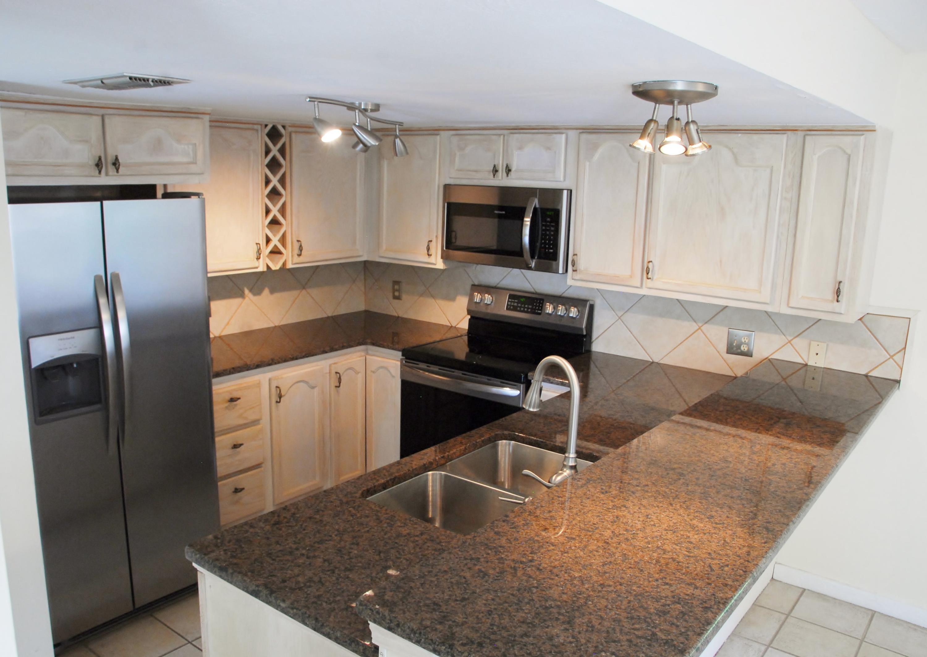LOCATION, LOCATION, LOCATION Welcome to The View. Only 4 units in this low- density community. This beautiful home has just been remodeled with granite countertops and sinks in the kitchen and all bathrooms; new stainless steel appliances in kitchen; new water heater; natural gas fireplace; A/C is just 2 years young and recently repainted. Along with the recent upgrades this home offers a vaulted ceiling and plenty of windows to let in natural light and skyscapes. The garage is a great asset along with an additional bonus room downstairs plus plenty of extra storage in laundry room, closets under stairs and additional storage room under back deck for storing beach gear, bicycles, etc. Enjoy the beach life south of Scenic Gulf Drive. The sound of the waves crashing on the beach and the gentle gulf breezes can be enjoyed on the two large decks off of the living room and master bedroom. Live the beach life with not one but two beach accesses located conveniently east and west leading to South Walton's beautiful sugar white sandy beach and Gulf Of Mexico for relaxation and fun in the sun. A private drive leads you to this home privately tucked away among the scrub oaks, magnolias and natural dune setting backyard, but shopping; grocery; restaurants; entertainment and golf courses are just right around the corner. No HOA fees to worry about. Make it Home, second home or great rental, the quiet and relaxing beach lifestyle is waiting for you. Come and see.