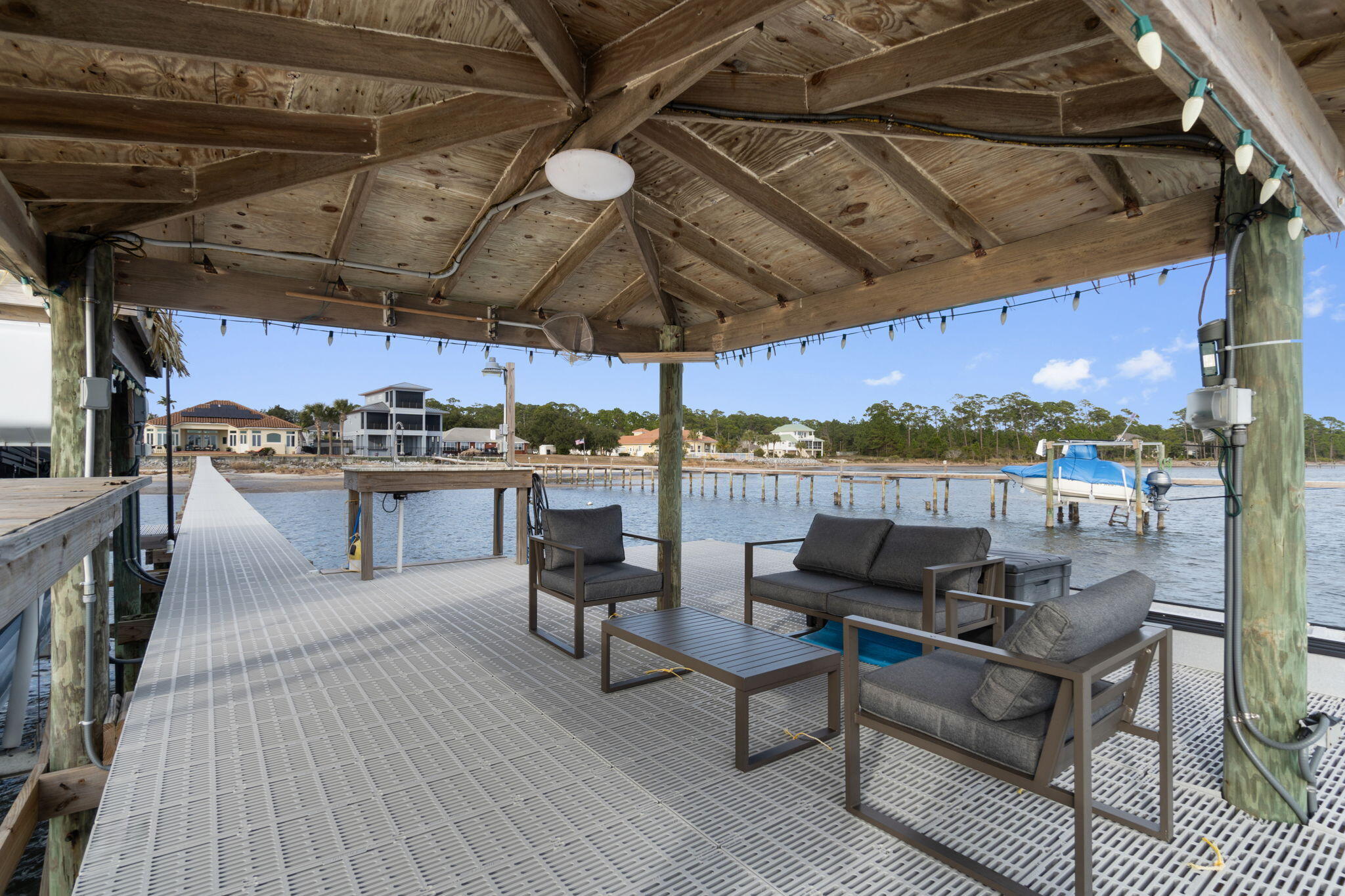 Beautiful waterfront home on Santa Rosa Sound. When you walk in through the glass front doors, the first thing you see is the breath-taking view that looks directly out to the water.  Open & bright, with oversize windows throughout the entire home, the rear windows are Pella Hurricane Windows. The gourmet kitchen was remodeled in 2023 with top-of-the line appliances to include double ovens, an induction cooktop and a Wolf Steam Oven and Built-In Coffee System.  Beautiful Quartzite Countertops and tons of cabinet space make this an absolute dream kitchen.  Head out to the back patio, where you will find the in-ground, gunite pool and large back yard, with a paver brick path leading down to another open patio area.  From there, you can head out to the impressive tiki hut boat dock, with flow through decking, a granite fishing station and two boat docks.  The Master Suite has a bay window sitting area, his & her closets, double vanities, a soaking tub and a separate shower, it also walks out to the pool area.  There are 3 additional large bedrooms, one is currently being used as an office.  Shaw Floorte waterproof LVP flooring through most of the home except 2 of the bedrooms have carpet and the master bath has tile floors.  There is a Formal Dining room and two separate living areas, perfect for entertaining guests.  This home also has an oversized 2 car garage with additional space for golf cart parking, a Generac Whole Home Generator, tankless water heater and Solar Panels that were installed in 2019.  Beautiful front yard landscaping with a paver brick driveway and  paths up to the front door and around to the back yard.  Just minutes from the white sandy beaches and emerald green waters of the Gulf of Mexico.  There are so many special features about this home, it is definitely a must see!!