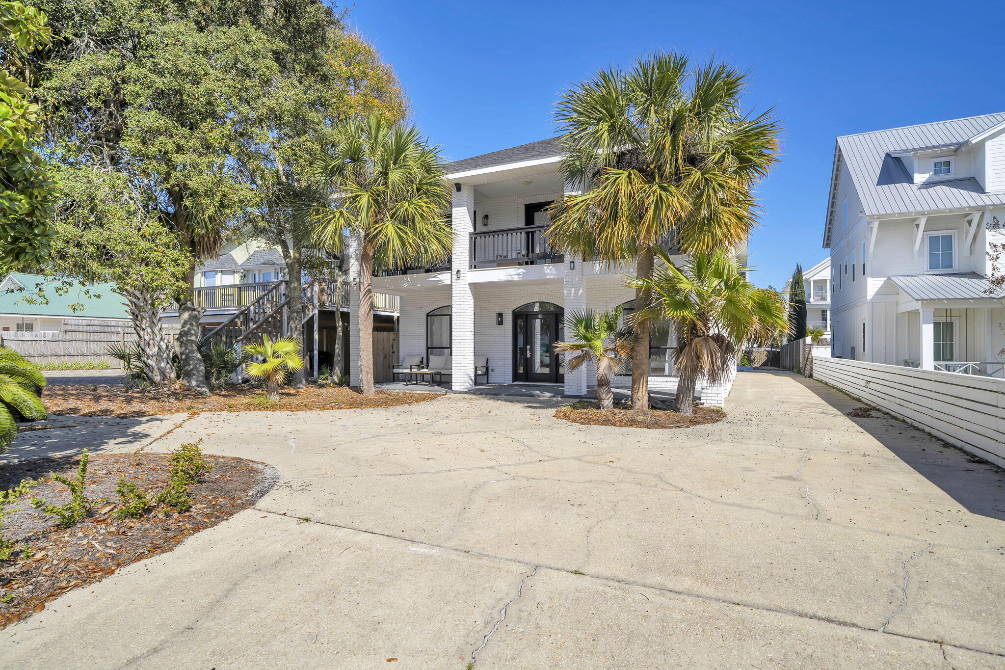 Just one block from the sugar-white sands of the Gulf, 91 Cobia Street offers the perfect blend of coastal luxury and exceptional investment potential in Destin's highly sought-after Crystal Beach community. This beautifully renovated beach home features six bedrooms and three-and-a-half bathrooms across more than 2,500 square feet, providing ample space for large gatherings and vacation guests. Inside, the home showcases stylish upgrades including new flooring, quartz countertops, and a bright open-concept layout designed for effortless entertaining. Large living and dining spaces flow seamlessly together, creating an inviting atmosphere perfect for hosting family and friends after a day at the beach. Step outside to your own private resort-style setting, complete with a brand-new pool, outdoor kitchen, and a rare private pickleball court--amenities that help the property stand out in the highly competitive Destin vacation rental market. Multiple porches and balconies offer the perfect place to unwind in the coastal breeze while enjoying the relaxed charm of Crystal Beach. With its unbeatable one-block walk to the beach and close proximity to Destin's top dining, shopping, and entertainment, the property is ideally positioned for both personal enjoyment and strong rental performance. Whether you're seeking a luxury vacation retreat, a turnkey income-producing property, or the best of both worlds, 91 Cobia Street presents an exceptional opportunity along the Emerald Coast.