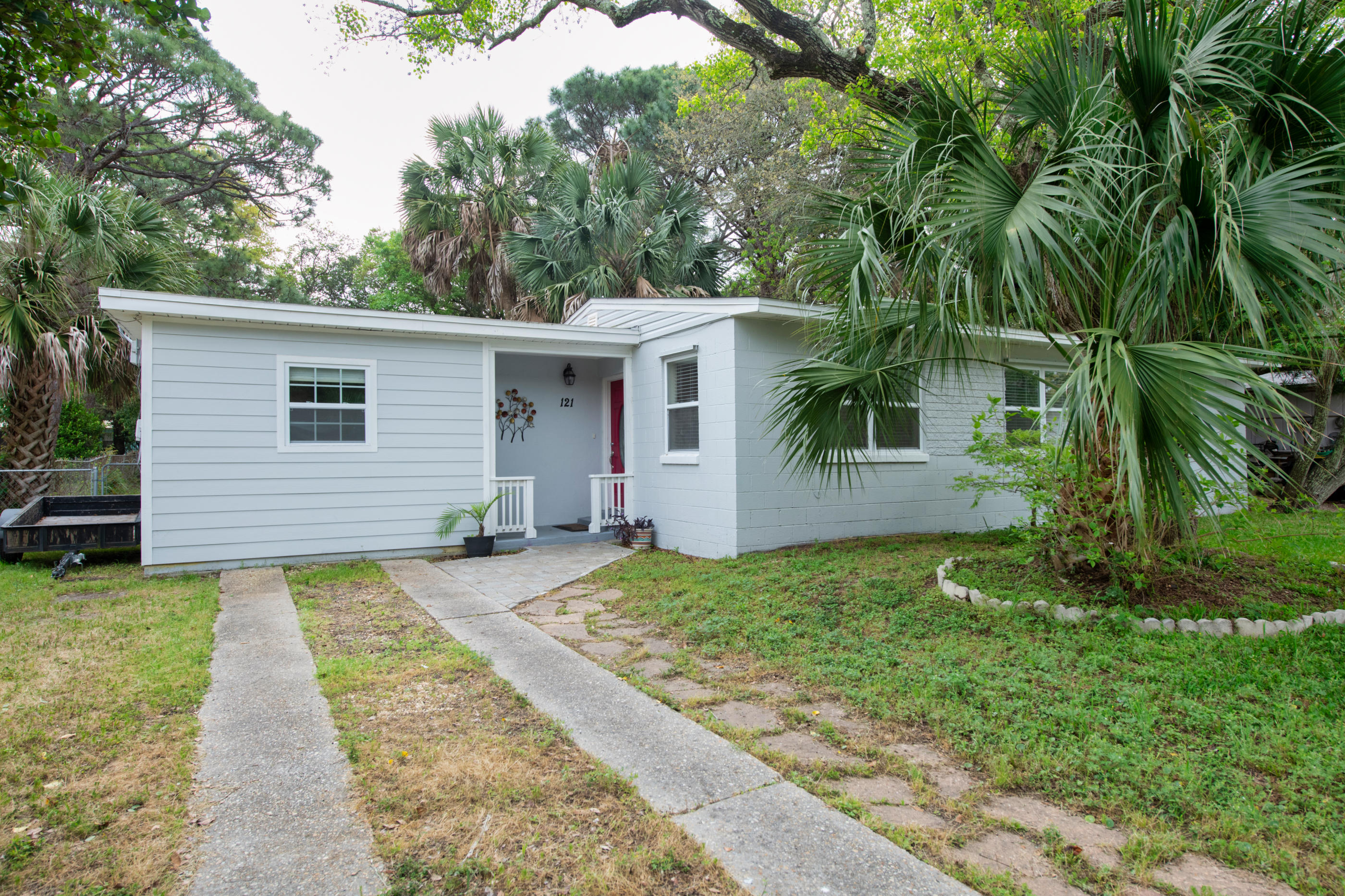 I'm ADORABLE inside. In 2018, my owner totally fixed me right up! New Kitchen, spruced up baths. New Doors! New light fixtures and fans! New Appliances. New Roof (Main house) 2018. New Water Heater 2019. Tidied up yard with nice patio and ample shade. Repainted inside and out. Redesigned Entryway. Composite siding added to the converted garage area, currently used for utilities and workshop. Extra square footage can be conditioned easily with a split unit. Two bedrooms have 2018 carpet. Hurry I won't last long!