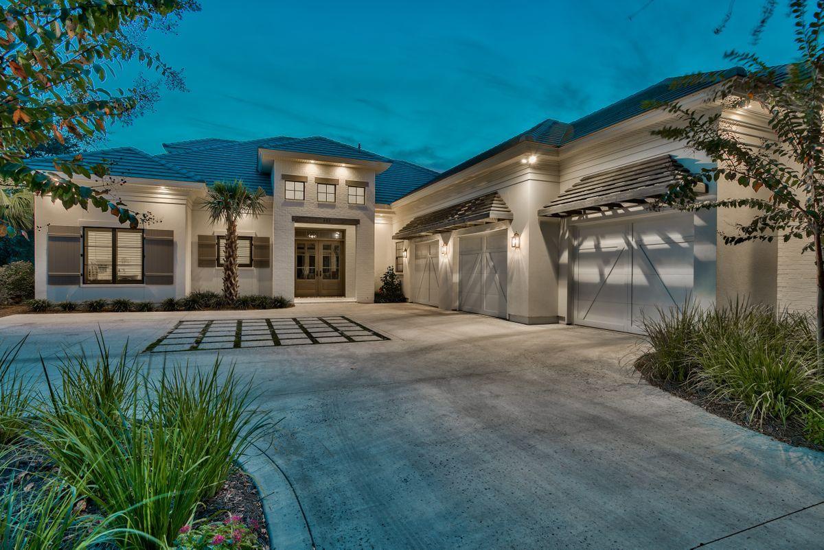 Modern elegance meets artful coastal contemporary design in this extraordinary lake front residence ideally located in the prestigious gated community of Regatta Bay. Completed in 2016, this finely appointed home offers exemplary architectural detail juxtaposing coastal Bermudan design with southern European influence; masterfully configured featuring four bedrooms, four and a half bathrooms as well as a spacious open floor plan characterized by clean lines & gorgeous designer appointments throughout. Notable features include 12' ceilings on the main level, oversized three car garage with ample parking, hardwood flooring throughout, a spacious living room anchored by a contemporary gas stone fireplace and allowing easy access to the oversized screened lanai complete with 650 sqft of outdoor living space highlighted by pecky cypress ceilings, a secondary outdoor gas fireplace, in-ground pool with fire rock pavers perfectly situated to capture western facing sunsets as well as views over the lake and par-72 golf course. The designer kitchen is well appointed and is complete with custom cabinetry topped with timeless Calcutta marble countertops and accentuated by stainless steel appliances including a 60" wolf gas range and built-in Sub-Zero refrigerator. The kitchen freely flows into the open dining room and also offers an oversized pantry with premium storage space. The master suite exudes coastal charm with 12' ceilings and a spa-like master bathroom complete with a soaking tub, dual vanities, chevron pattern marble flooring and oversized walk-in shower complete with hand sewn beam accents & dual shower heads. The 13x16 master closet is an exemplary space of it's own, with direct access from the master suite it features custom-built shelving as well as a center island for optimal storage. The mud room / laundry area also connects to the master closet for optimal ease of use. The second floor offers two additional bedroom suites complete with ensuite bathrooms as well as a fifth living room space that can be utilized as a game room or additional storage. 

Regatta Bay is an exclusive gated enclave set in the heart of East Destin highlighted by it's par-72 golf course & meticulously manicured grounds & clubhouse. The community is strategically located within close proximity to boutique shops and restaurants in the Destin Commons as well as Whole Foods market and premium outlet centers all catering to the executive lifestyle this location affords.
