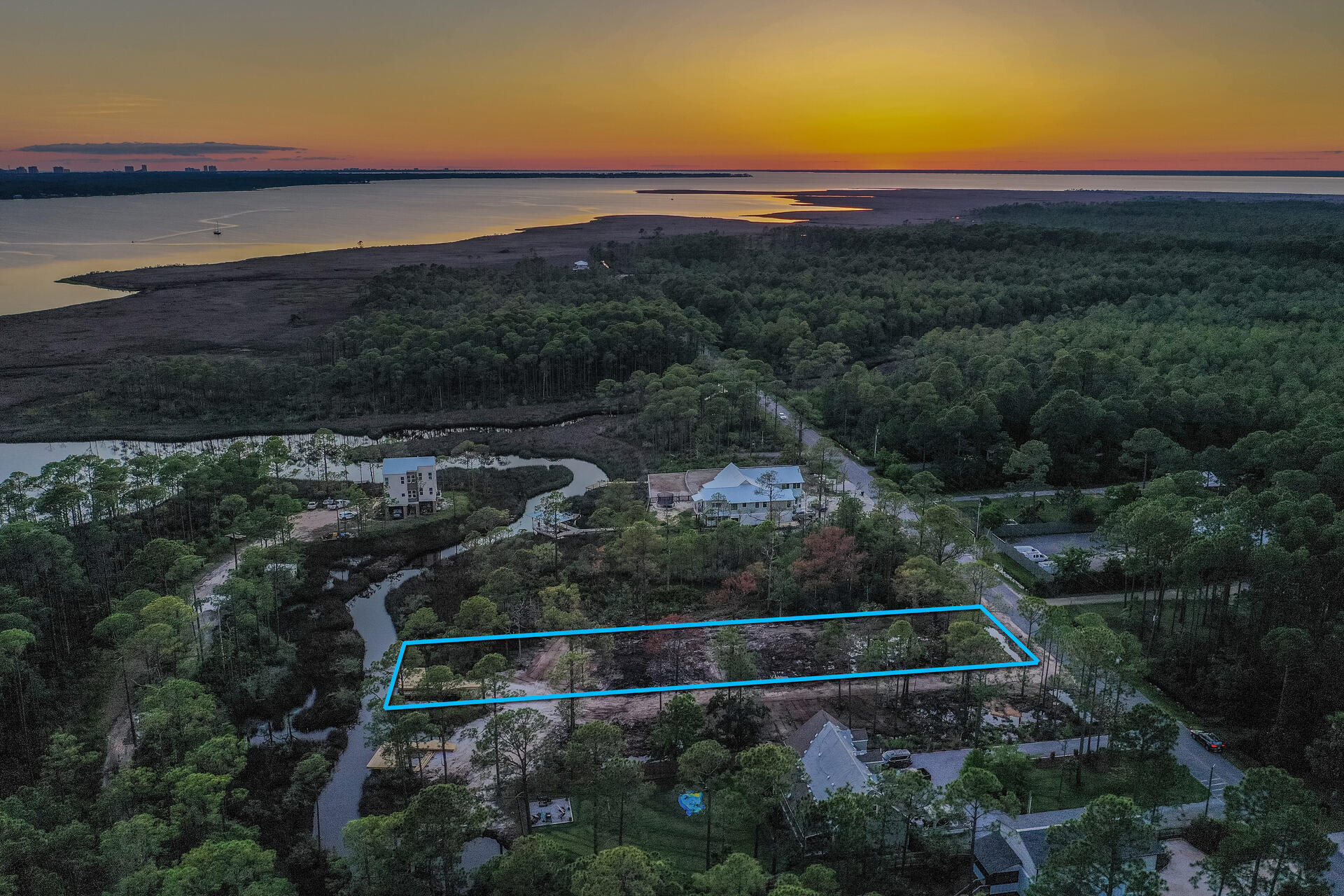 Bring your boat. This canal front lot offers immediate access to the bay. enjoy spacious water front living on this 75x303 foot lot. The lot is build ready with a survey, driveway, culvert installed, brushcut and has a dock. The lot has plans and will allow for a carriage house. No hoa or buildout time. Less than a one minute boat ride to Cesna landing and only a 4 mile ride to the beach. The lots are centrally located between Pier Park and Destin Commons