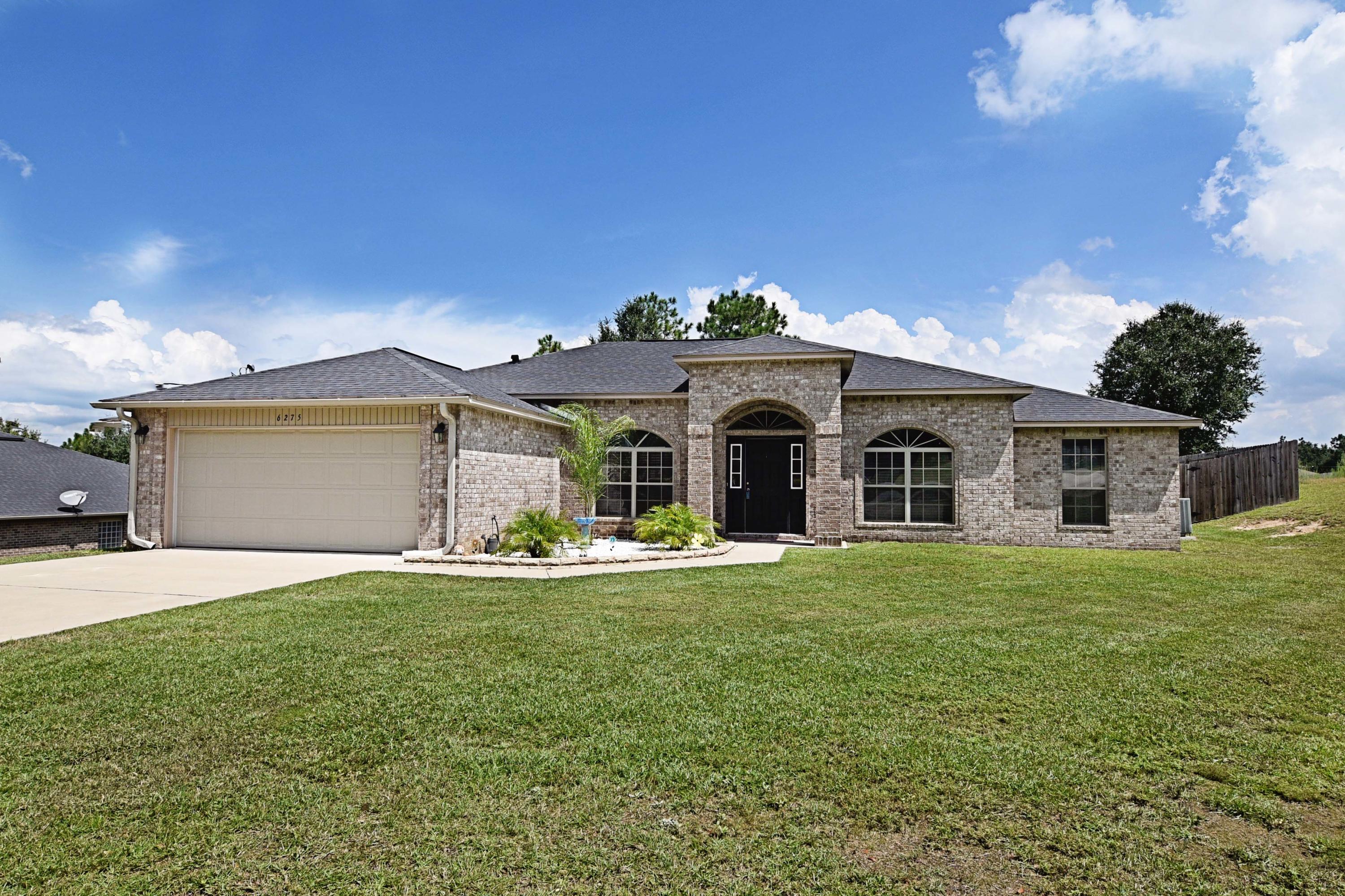 This MUST SEE stunning home has been meticulously maintained and is in MOVE IN condition! Better than new, it features many upgrades including GRANITE counter tops,STAINLESS appliances, HARDWOOD flooring,fully FENCED backyard,low maintenance BRICK exterior, and HUGE.64 lot, perfectly suited for a future pool! Do you need room to park your boat or RV? This home has room and a double gate to help get vehicles in.From the moment you enter, the high 10 foot ceilings add an open airy feel to this one story home. The kitchen is quite large and is perfect for a serious cook. Featuring elegant dark cabinets offset by light granite and a gorgeous back splash, it is perfect for entertaining and open to the large family room.The large island and breakfast bar add to the convenience for a busy family The large open family room can house the largest media set up! The split floor plan offers 3 bedrooms on one side of the home, and the large master bedroom and bath on the other side.The double vanity has lovely granite counter tops and you are sure to enjoy the separate shower, garden tub, and large walk in closet! This home is sure to sell quickly! please call to see it today.
