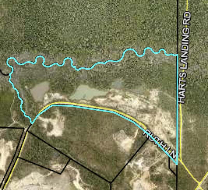 One time it was used as a Sand Pit.  

To my knowledge the road is partially maintain by the the Air Force.