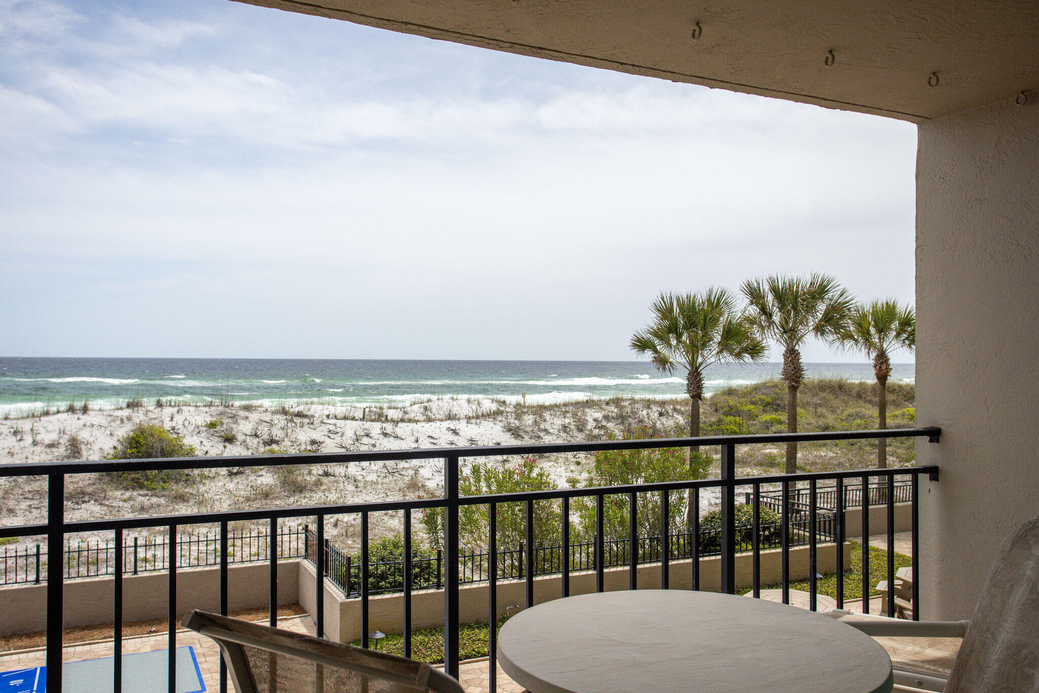 Immaculate 1 BR 1.5 BA 2nd floor unit with amazing beach and  water views! Turn key and rental ready. Fully furnished and tastefully updated . Upgrades include recessed lighting, scraped popcorn, textured Spanish lace walls (in hallway), and tile throughout (NO CARPET). Kitchen has granite countertops, breakfast bar, and matching wet bar around the corner. Living room is spacious with a comfortable sleeper sofa. there is an  office area, large flat screen tv and a  Washer/Dryer in unit. New insert shower/tub combo in the private master bathroom.  HVAC replaced  2015. Water Heater 2016. 2021 rental income $44k.