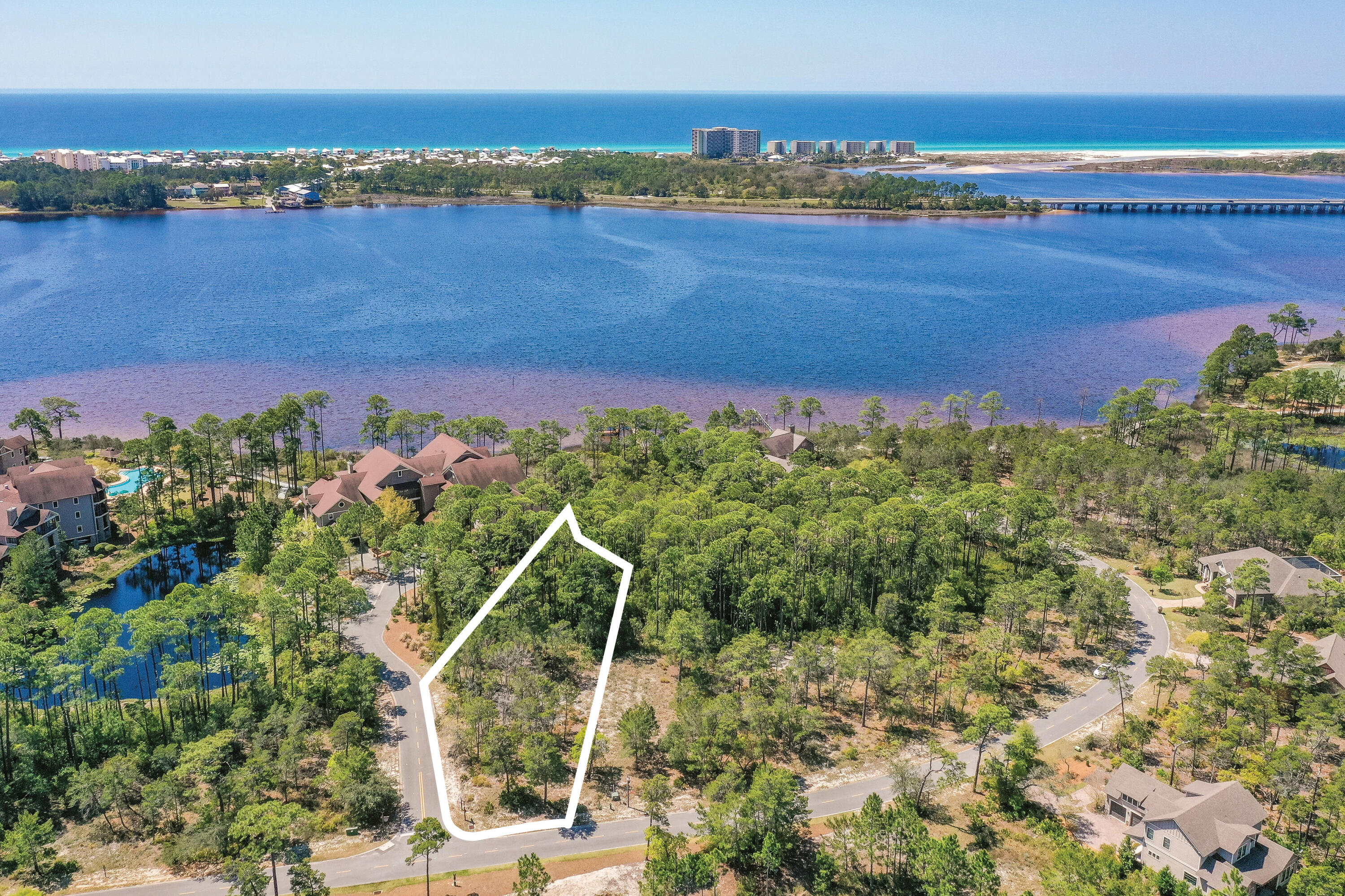 Build your dream home on this spacious .47 acre home site, close to all the amenities, in the beautiful gated community of Wild Heron, 734-acre Coastal Sanctuary, located on the shores of Lake Powell. This beautiful corner lot backs to a conservation area and borders two streets allowing for more architectural opportunities. It is just a 3 min. walk or short bike ride to all the amenities on Lake Powell where you can kayak or paddle board to the World's Most Beautiful Beaches. Enjoy living on the quiet west end of Panama City Beach, with just a quick drive east to Pier Park or west over the bridge to 30A. Wild Heron is known for its world-class amenities including a lake view swimming pool, health & fitness center, ring fire pit, lakeside boardwalk and a revered oak-filled family park that features many types of fun filled family events. The lakefront boathouse and gathering place is well stocked with kayaks and canoes. A series of boardwalks and 24 miles of bike paths link the amenities for the convenience of all who call it home. Wild Heron is also the proud home of the Greg Norman designed Sharks Tooth Golf Course and hydro court tennis courts and can be enjoyed with a membership. Just minutes from world class shopping, dining, entertainment, 30A and the Beaches of South Walton, makes this home site an ideal location.  Buyer should verify all data and approximate dimensions.  Call today for a viewing.