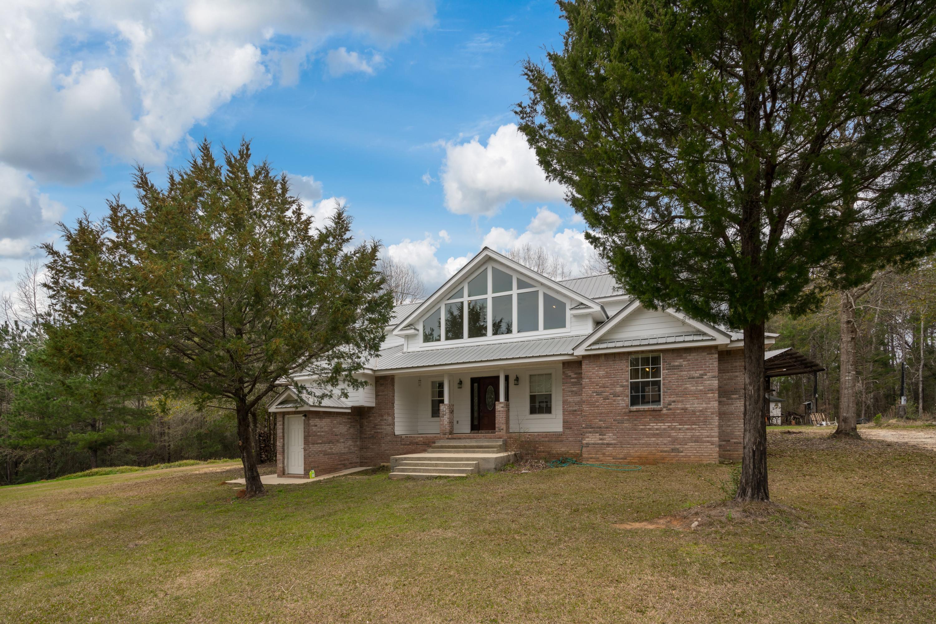 Come view this wonderful property that sits on 20 acres. Morrison, Vortex and Ponce de Leon Springs are just a few short miles away. The home is a very spacious and open concept that has lots of natural light through out the home. It is a two story home with an unfinished basement that would be a perfect work shop, wine cellar, and/or root cellar. There is a work shop/garage behind the house that could be used as a garage and/or storage shed. There is a plethora of wildlife on the property for that hunter or wildlife enthusiast.