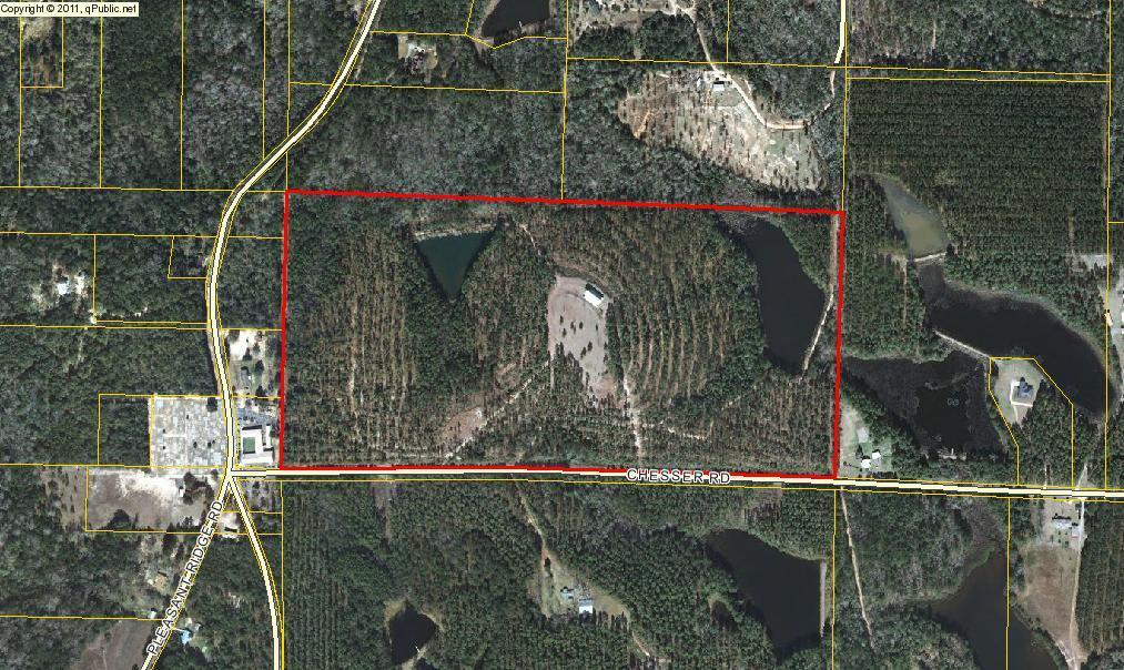 Attention hunters, fishermen, horse lovers and outdoor enthusiasts. This executive ranch can be utilized in many different ways. Perfect for horses. Excellent deer & turkey hunting. Fisherman's dream come true with two private big bass lakes ( 2 acres & 5 acres ). Subject property has a 5758 S.F. metal barn with 1200 S.F. living quarters on the 2nd floor. First floor of barn has workshop area, full kitchen, bath and two commercial electric powered roll up doors at each end for easy access . Trails have been cut through out the property. Seller estimates there is $75,000.00 to $100,000.00 worth of merchantable timber. The property is totally fenced. 2500 feet of paved road frontage. Property is located south of I-10. Easy access to the beaches .