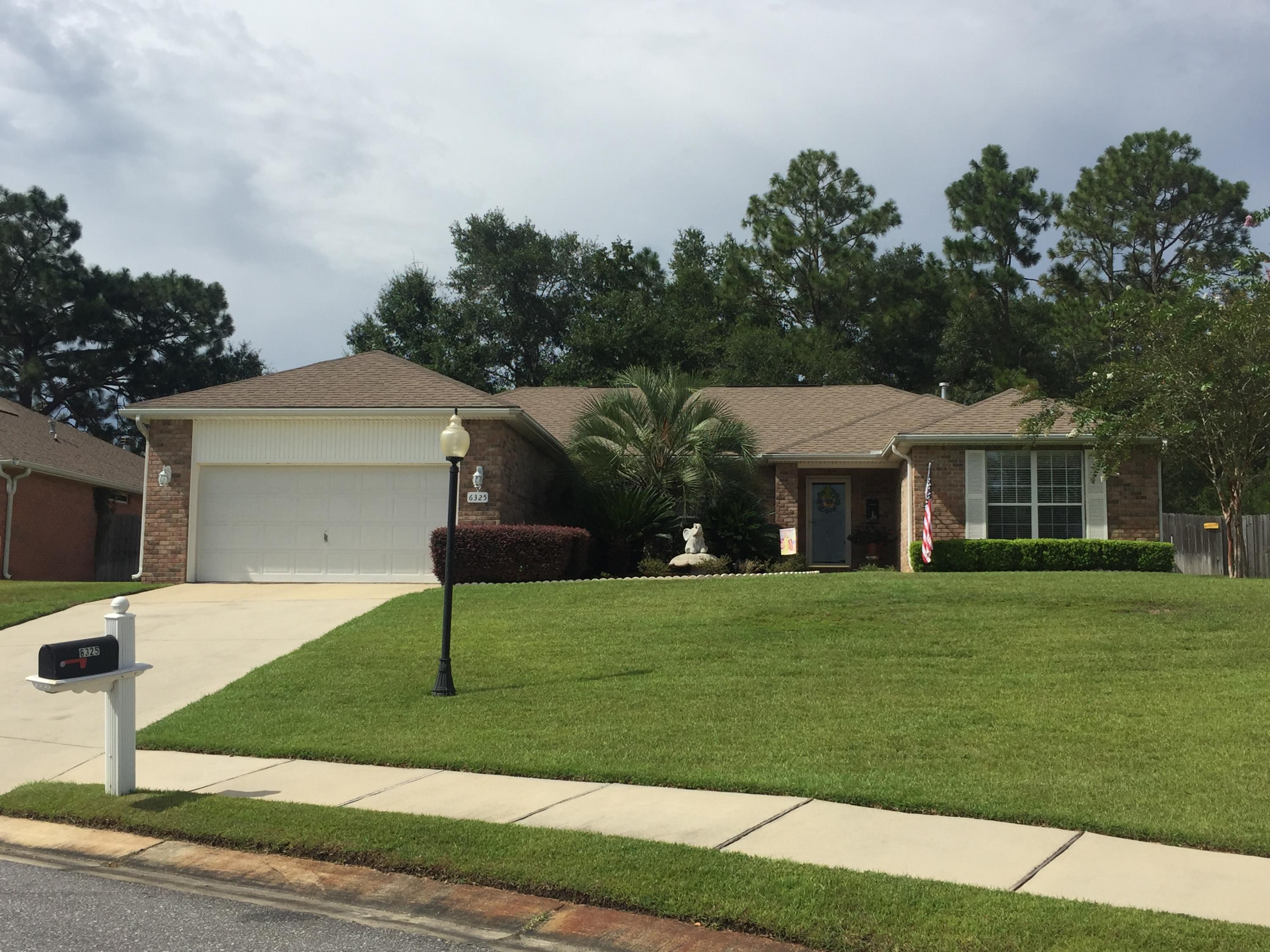 One owner, well maintained, workshop, Florida Room, Hot Tub, desirable location with community pool... These are just a few of the offerings in this lovely 4 bedroom 2 full bathroom home. The interior is well appointed and immaculate. The huge open concept kitchen features a ton of counter and cabinet space, including a built in desk/ wine bar. The floor plan and flow are great, the room sizes are nice, and the landscaping and curb appeal are fantastic. Relaxation is guaranteed in this home, whether in the year round added Florida room, by the gas fireplace, in your private hot tub or in the Man Cave out back. Located only 3 minutes from area schools and the new Publix shopping center, and a quick commute to area bases. This home checks all the boxes, shouldn't you be packing yours?