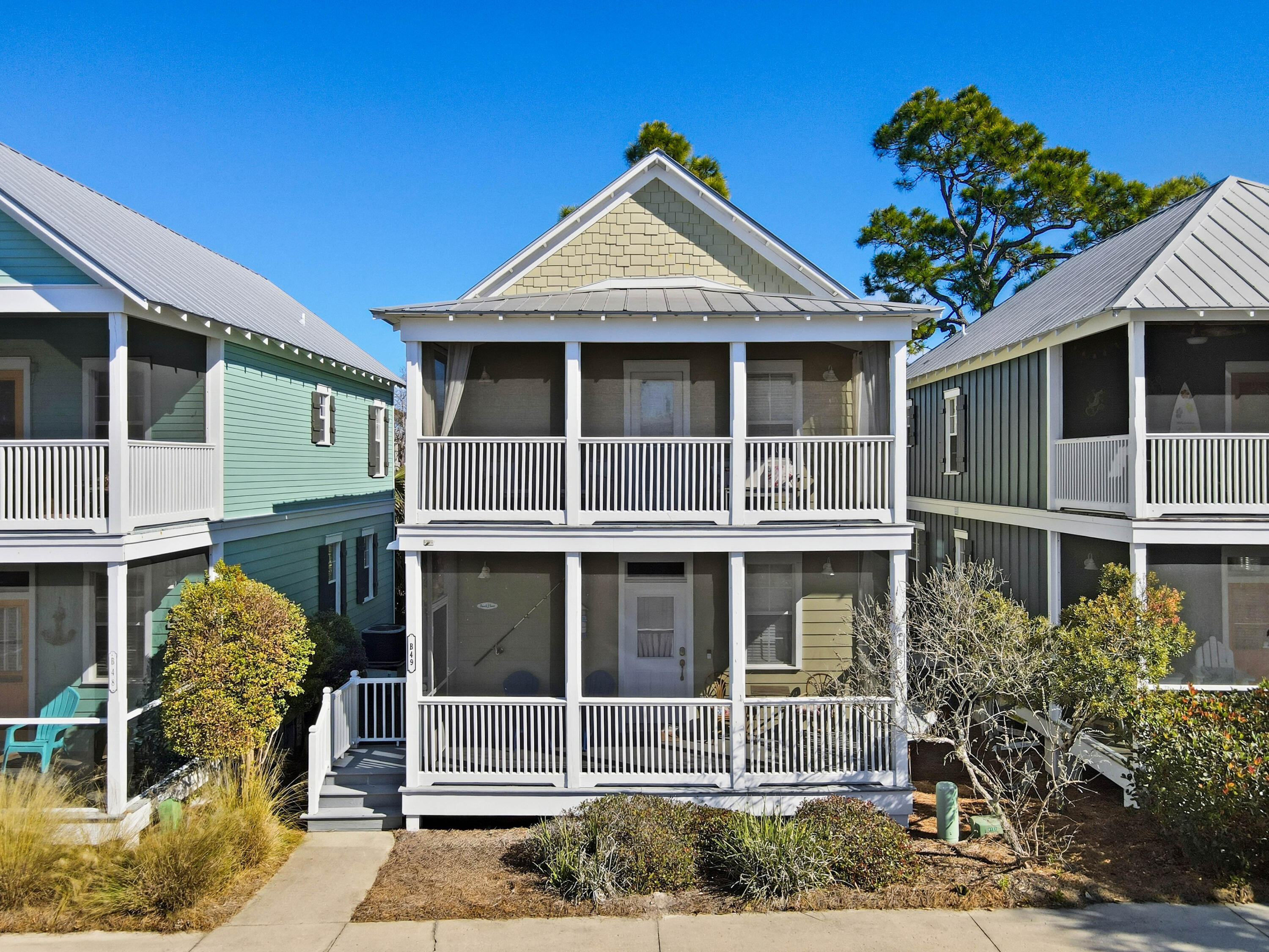 Welcome to 3050 W Hwy 98, Unit B49, an adorable, fully furnished beach bungalow located inside the gated community of Barefoot Cottages in charming Port St. Joe. Priced at $298,000, this is currently the LOWEST- PRICED beach home in the community, making it an outstanding opportunity for a primary residence, vacation rental investment, or personal beach getaway. This 2-bedroom, 2.5-bath, 1,200-square-foot home offers a cozy bungalow vibe with two spacious bedrooms, each featuring a private ensuite bath—perfect for guests or rental flexibility. The primary suite includes a walk-in closet and a private screened-in balcony, ideal for morning coffee or relaxing after a day at the beach. The main living area flows into an updated kitchen with white cabinetry, stainless steel appliances, ... ... stainless steel appliances, and two-tone granite countertops, creating a welcoming space for entertaining. A large screened-in porch extends your living space outdoors and invites year-round enjoyment. Residents and guests of Barefoot Cottages enjoy three on-site swimming pools, hotties, a community fitness center, and close proximity to beach access, all within a beautifully maintained gated setting. Ideally located between the WindMark Beach community and downtown Port St. Joe, you're just minutes from shopping, dining, marinas, and local charm. Fully furnished - Resort style amenities - Prime location - Unbeatable value! Don't miss your opportunity to own this exceptional beach home for an exceptional price. Schedule a showing today.