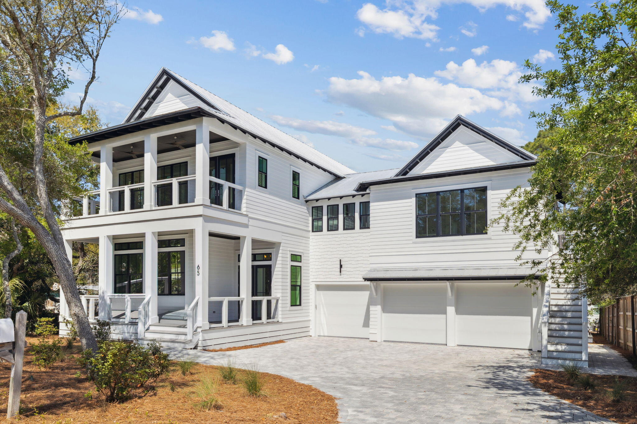 FULLY FURNISHED AND RENTAL READY AS OF 1/12/2025

Welcome to 65 S Gulf Drive, a stunning new construction beach home tucked away on a large, private lot in the sought-after Eastern Lake area, just steps from the Gulf and located south of 30A. This exceptional property is designed for refined coastal living with a focus on comfort, elegance, and space.

Spanning over 5,000 square feet, this beautifully crafted six bedroom, seven bathroom residence offers a seamless blend of indoor and outdoor living. The open concept layout is ideal for entertaining, with expansive living spaces flowing effortlessly to the private heated pool, spa, and wet deck, creating an outdoor oasis after a day at the beach.

Inside, the home features luxurious finishes throughout, a spacious primary suite wit