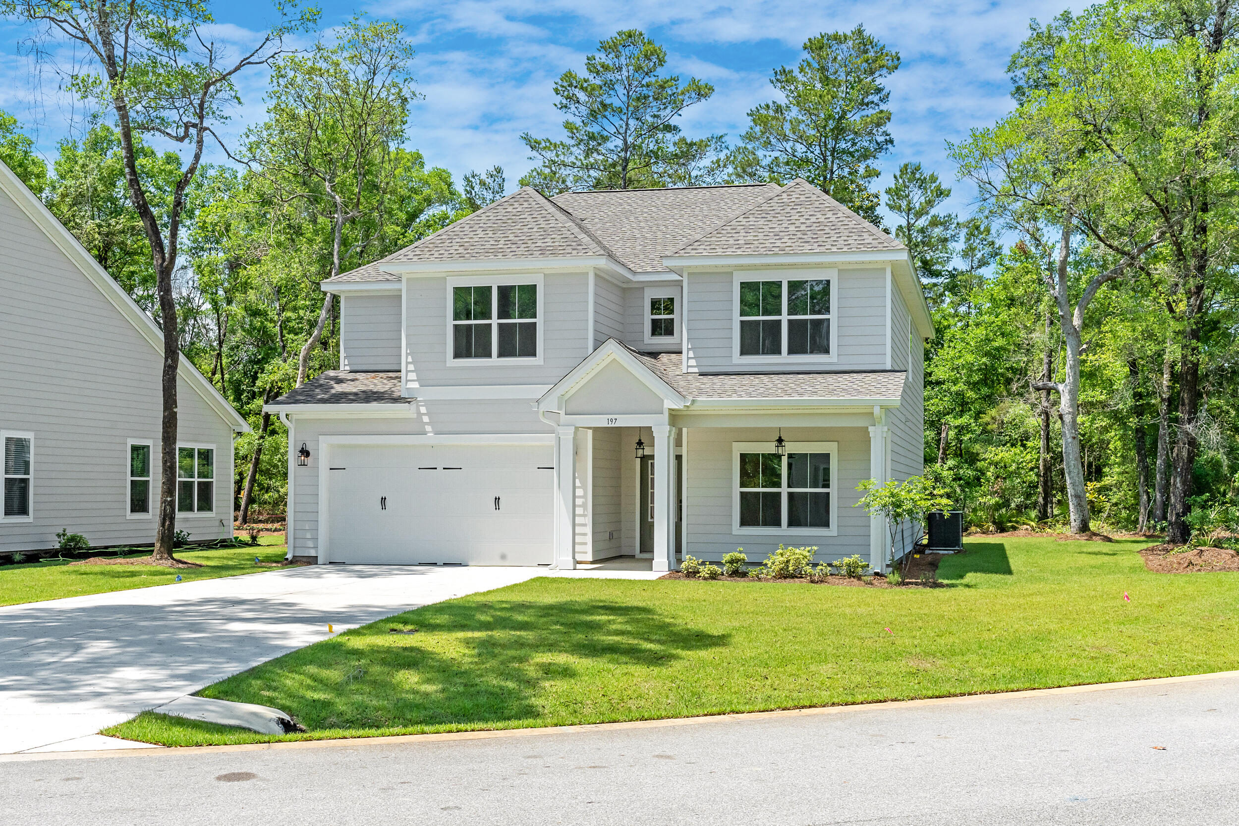 Ready Now!  Priced to sell!  Up to $20K in Closing Costs on all contracts written by 11/30/25.  Must use Preferred Lender.  Magnolia Bay Estates is a gated community, located conveniently off FL-20. This highly desirable 2 story home reflects living at its finest. The Fulmont home plan which will sit on Lot 29, boasts 5 bedrooms (1 on the main level) and 4 full baths with a 2-car garage. The kitchen is bright and airy with quartz counter tops, island and large walk-in pantry. Large open concept living in the main areas. Loft is perfect for an office. The large back porch is screened and is perfect for entertaining. The main bedroom has a spacious walk-in closet, separate shower/tub and double vanities.  Blinds throughout the home.