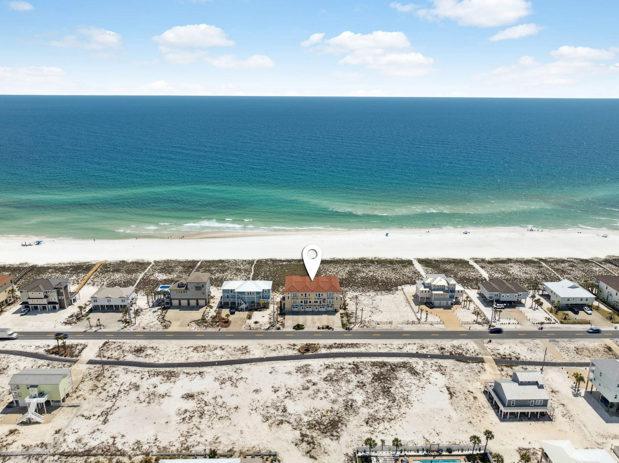 ''At Last'', located at 8037 Gulf Blvd, awaits! Your fully furnished, immaculate 4 bedroom, 3 bath beach front Florida dream townhome rises majestically above the gulf and is 800 feet away from public beach parking! A few highlights include elevator with stops on each floor, incredible Gulf and Sound views, open floor plan, balconies, convenient beach walkover, fabulous floor plan with tall ceilings throughout, freshly painted exterior, tandem design 2 car garage, plus NO HOA FEES. Plug in and start playing today!  The garage with ample storage features two sets of exterior French doors which led to a ground floor patio the width of the townhome. It's easy ''At Last'' to set up for a day at the beach. As you enter the townhome foyer through the front door, you find gracious storage for all your gear. The foyer leads to the elevator and stairwell which is also accessible from the garage.  Once you reach the main living area beautiful views of the Gulf of America unfold before your eyes and you are drawn to the outdoor living space and beach walkover leading to an expansive beach. The main living area with open floor plan features a bedroom and views of the Gulf and the Sound.  The kitchen with walk in pantry and island perfect for bar stools marries the dining and living room. The resident chef can entertain while cooking the day's catch. Ascending to the 3rd floor via elevator or stairs, the Primary Ensuite Bedroom with Romeo and Juliet balcony is graciously sized and allows room for a king size bed plus seating. Two of the guest bedrooms, one of which features a lovely balcony, share a Jack n Jill Bathroom with dual lavatories separated by a door allowing privacy from the tub/shower and toilet. Two of the three guest bedrooms enjoy Sound views. Don't miss this opportunity to Live and Play in beautiful Navarre Beach. You can own "At Last" in one of Florida's Most Relaxing Places. Navarre Beach was recently featured in Coastal Living as one of the Gulf's best kept secrets. We invite you to the sugary white sands of 8037 Gulf Boulevard near the Gulf Islands National Seashore and the serene Santa Rosa Sound's intracoastal waterway. Kick off your flip flops and begin living the Florida Dream "At Last".