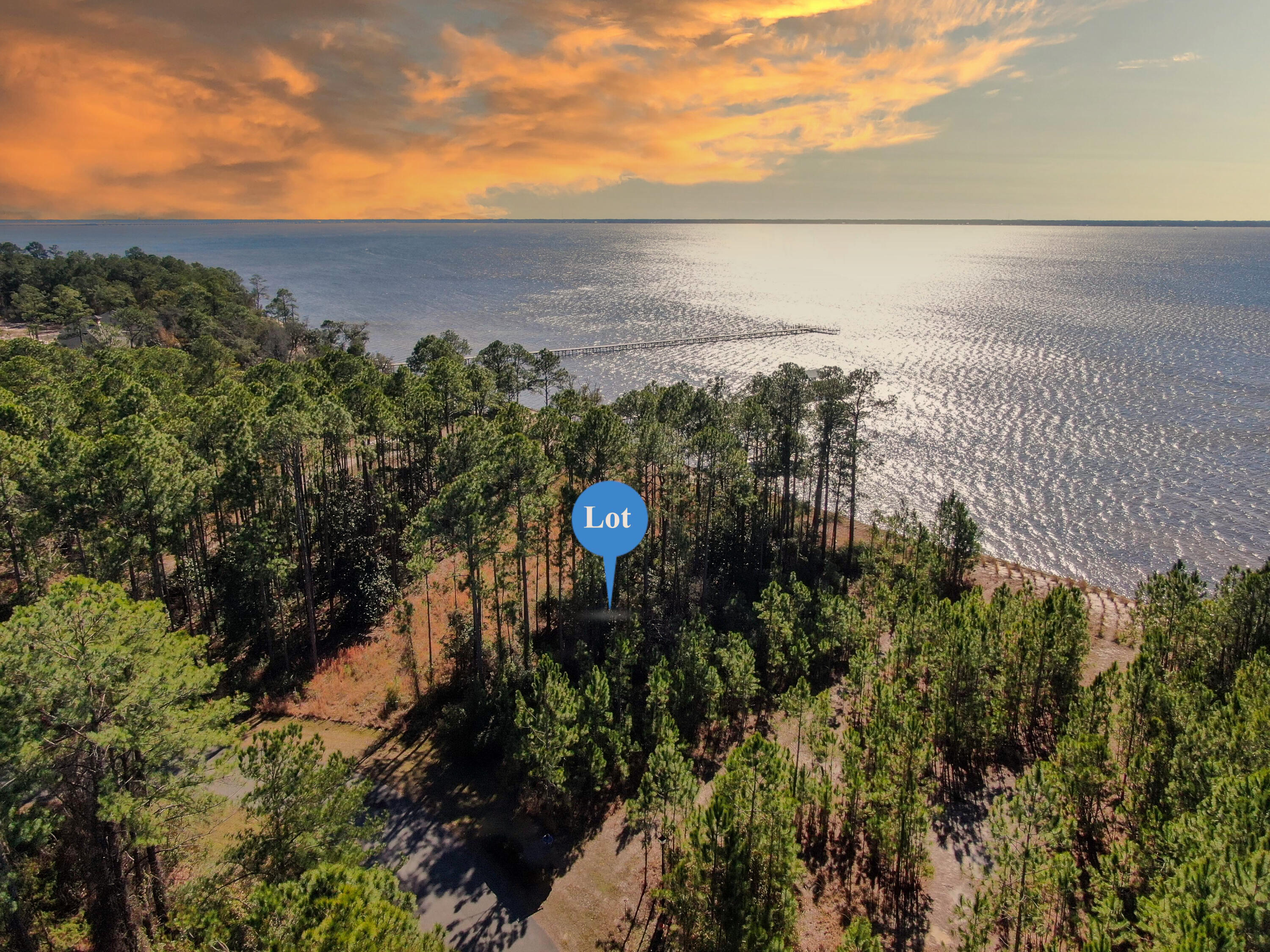With panoramic water views and endless design potential, build your dream home here! Wake up to the peaceful beauty of the bay and soak in breathtaking sunsets that paint the sky year-round. Whether you're envisioning a serene escape or an entertainer's paradise, this property is your blank canvas to make it happen. Ideally located just a short drive from the sugar-white sands and emerald waters of Florida's Gulf Coast, you'll enjoy easy access to world-class beaches, dining, and recreation—whenever the mood strikes. This is more than just a lot—it's the start of something extraordinary. Build the life you've always imagined in this exceptional bayfront community.