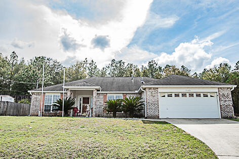 ...Almost 2000 square feet in South Crestview with easy commute to bases, beaches and shopping.  Vaulted ceilings, wood burning fireplace, natural light, open concept and spacious living areas to include a separate dining area for a large table and buffet.  Separate eat in kitchen area adjacent to the kitchen overlooking the back yard.  Breakfast bar and nice stainless appliance package.  Laundry room and 2 car garage.  Bedrooms are large as well as bathrooms.    The screened back porch area allows for additional lounging space.  This home has a massive back yard for entertaining.