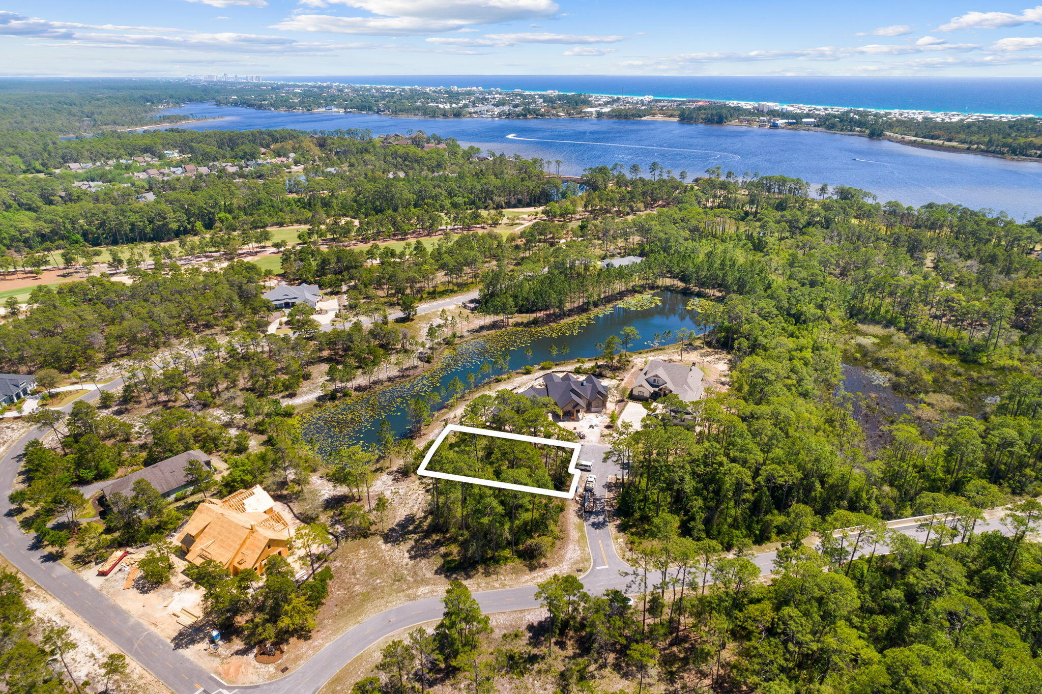 Inside the private, gated Wild Heron community, this stunning 0.33-acre lot is situated on an exclusive street and backs up to a serene pond, offering breathtaking views and a peaceful atmosphere. With its location, you have the freedom to create a home that perfectly suits your lifestyle and aesthetic preferences. Whether you're looking for a spacious family home or a cozy retreat, this lot offers endless possibilities. Impressive custom homes are being built in vicinity. Flood Zone X. As part of the Wild Heron community, you'll enjoy world-class amenities. Other amenities include a clubhouse, heated pool, hot tub, fitness center, boat house, boat dock, campfire ring, and playground.