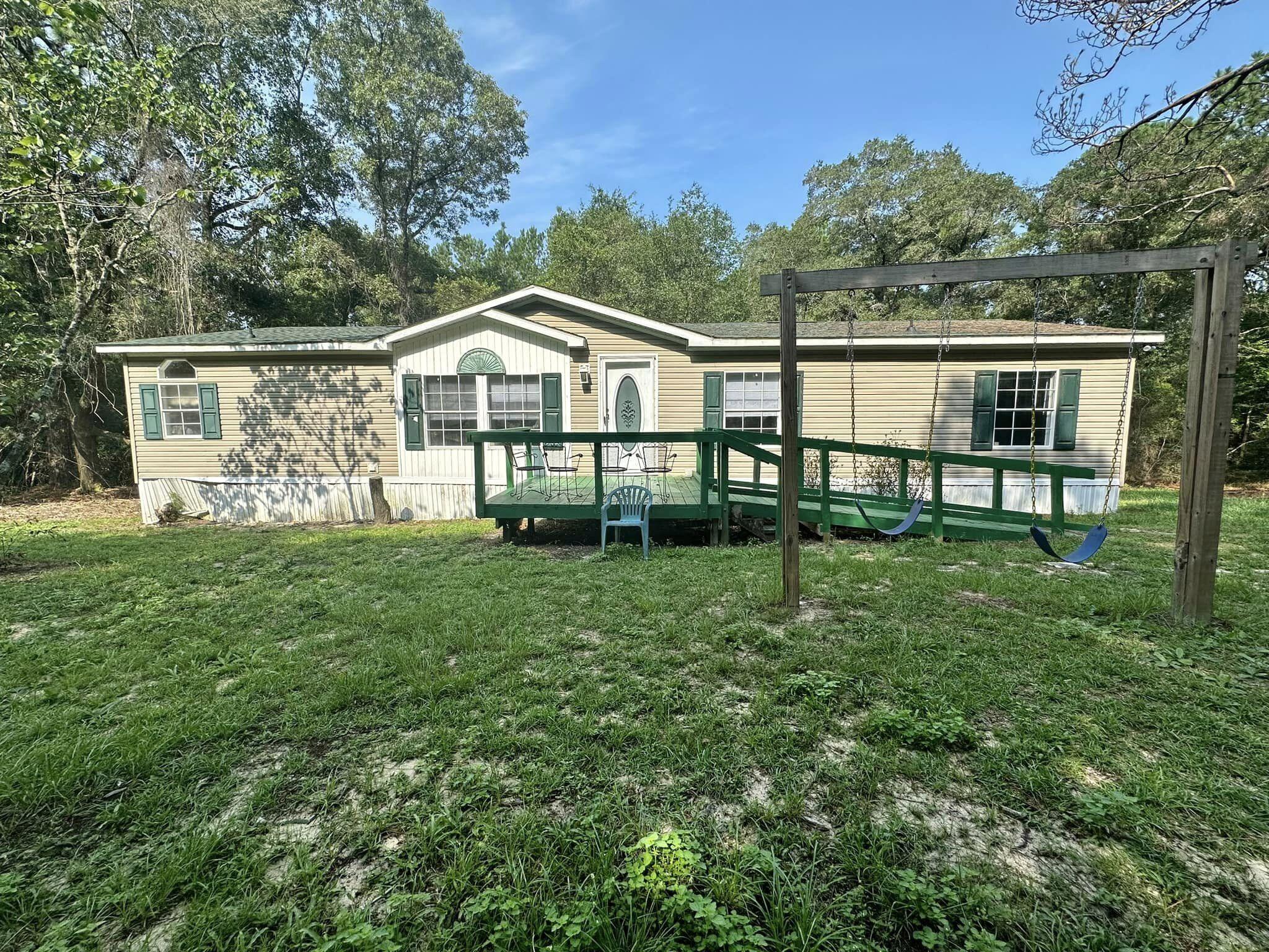 Ready to rent!!! Three bedrooms each with a walk in closet, two bathrooms and an open floor plan made for easy living tucked away in the woods but not far from town on two acres! Huge kitchen with ample cabinets and counter top space. Washer and Dryer included! Don't let this opportunity pass you by! Requirements are as follows- credit score of 600 or better, household income minimum of  $3625, one year on the job unless you are moving here for an employment offer! Pets are case-by-case basis.