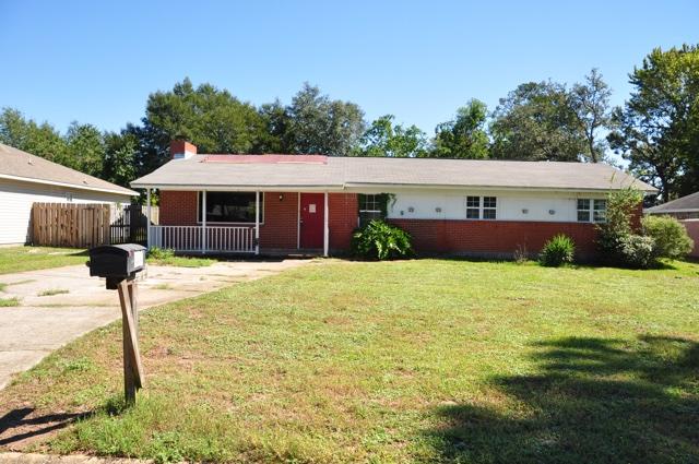REO. Spacious ranch home located in west Fort Walton Beach! Home features three bedrooms, two full bathrooms, and a spacious backyard. As you enter inside the home, you will find a beautiful all brick fireplace in the large living room. The backyard features a large covered patio where you can relax under after a long day and escape the sun during those sweltering summer months. Home is located in the heart of Fort Walton Beach, so you are close to everything (schools, restaurants, Eglin AFB, ect). Home being sold AS IS.