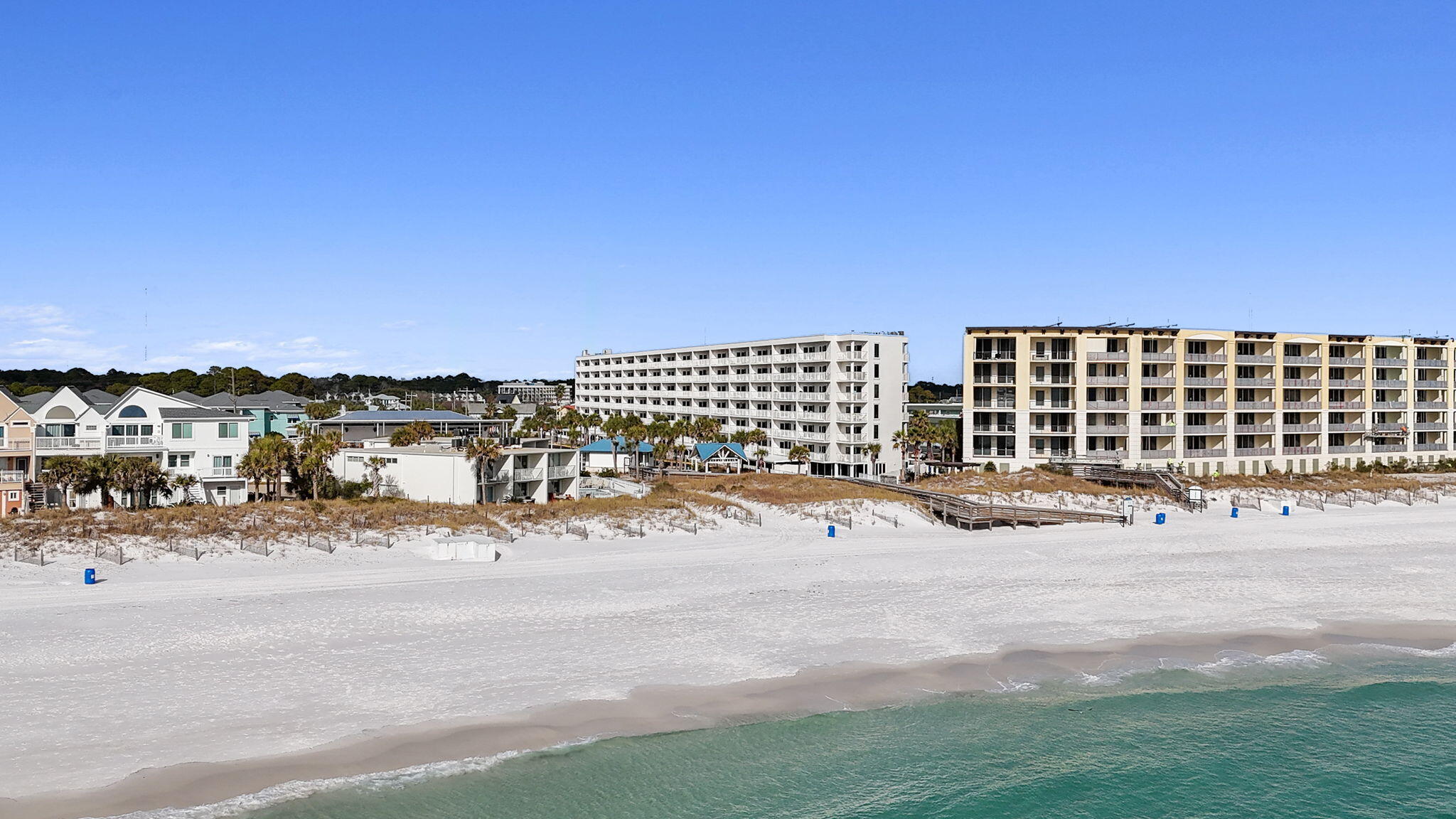 Not one, but TWO condos with beautiful views from the Gulf to the Sound: 2-bedroom 2-full-bath plus a lockout 1-bedroom 1-bath, each with its own separate balcony. Terrific vacation rental, or live in one and rent out the other (short or long term)! VA Financing approved. This is one of the larger units at 1,300 square feet. Seacrest is a gulf front complex covering 1.9 acres total. It has an indoor and outdoor heated pool and on an onsite gym. The beach entrance is only steps away! Seacrest just finished a total overhaul with new hurricane-resistant doors and windows, the entire exterior painted and the pool was refinished. Both units underwent complete refresh to include but not limited to with luxury vinyl flooring, new paint, new TVs, kitchen countertops, new cabinet faces and updated furniture, main kitchen has newer appliances. 

For vacation rental numbers please see the document section for full details. Come see what living in paradise on the sugar white sand beaches, swimming in the emerald green water, and enjoying the breathtaking sunsets. This condo is the place to be located at the end of the boulevard, away from the hustle and bustle of mainstream tourism, but still conveniently located near all the attractions, restaurants, and shopping the beautiful Northwest Gulf Coast has to offer. Buyer to verify all information important to them.