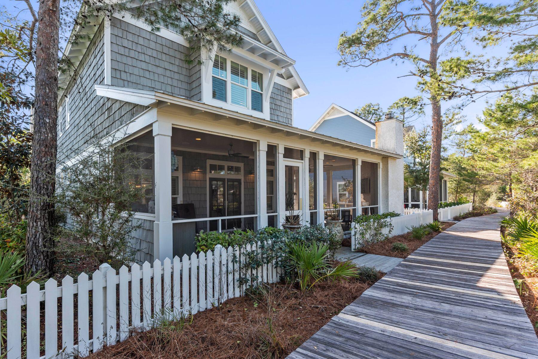 Experience the coastal lifestyle of Watersound West Beach in this luxury Nantucket inspired home featuring 5 bedrooms, 5.5 bathrooms and a spacious carriage house. Skillfully designed for open living, this home offers comfortable space for entertaining or retreating away. The gourmet kitchen and dining area seamlessly flow to the oversized screened in porches which are finished with a private fireplace, outdoor kitchen, and porch swing day bed while juxtaposed to the subtle boardwalk that takes you to the beach and makes Watersound West Beach such an amazing retreat.  As you enter, you are immediately relaxed by the soft designer touches that include a freshly painted interior; featuring shiplap, white oak hardwood flooring, new fixtures, and designer furnishings. The kitchen features top of the line appliances, wine refrigerator and butler's pantry. This home features a freshly appointed master bedroom on the first floor which includes a new brick fireplace for the ultimate ambiance, fresh new wall coverings by a local designer, and spa level master bath fit for the perfect beach retreat in style. Walking upstairs you'll find a separate open living/hang space and three additional bedrooms, two of which are additional master bedrooms and each with an en-suite bathroom. The other charming affect of the home is the open carriage house with separate private entry for a truly optional feel for completing the fifth bedroom and living space of the home. 

With easy access to the community pool and clubhouse, a private beach access, and access to all Maingate Watersound amenities, you are enveloped in a true beach living lifestyle. Watersound West Beach is a gated community ideally located within close proximity to the Hub, Seagrove and Seaside. This elegant and spacious Watersound West Beach property is ideally suited to be a primary residence, second home or investment rental property.